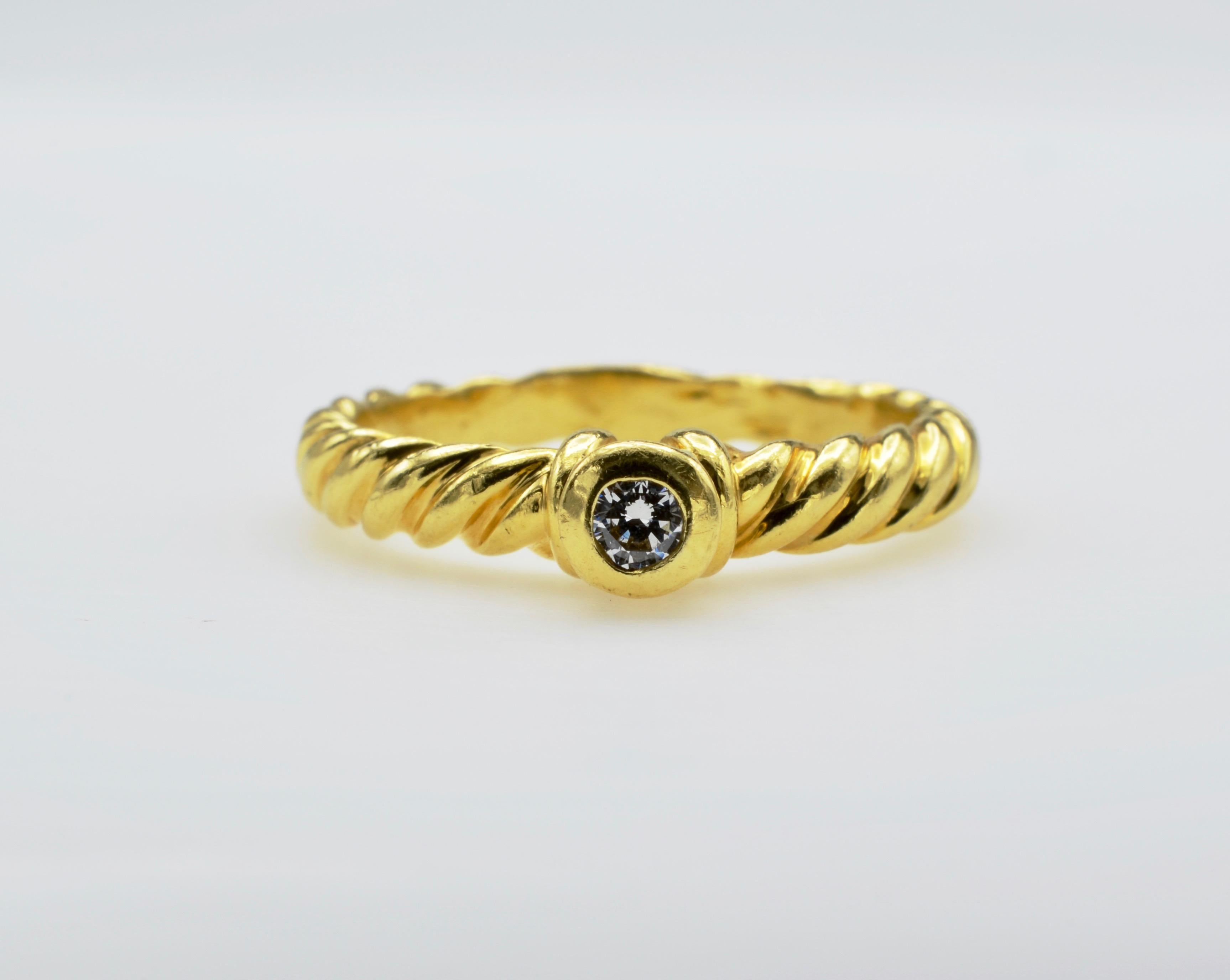 This lovely twisted rope band with a 0.15 ct diamond is a wonderful and whimsical engagement ring or just everyday ring. The ring is a size 8 and can be sized to fit your finger.