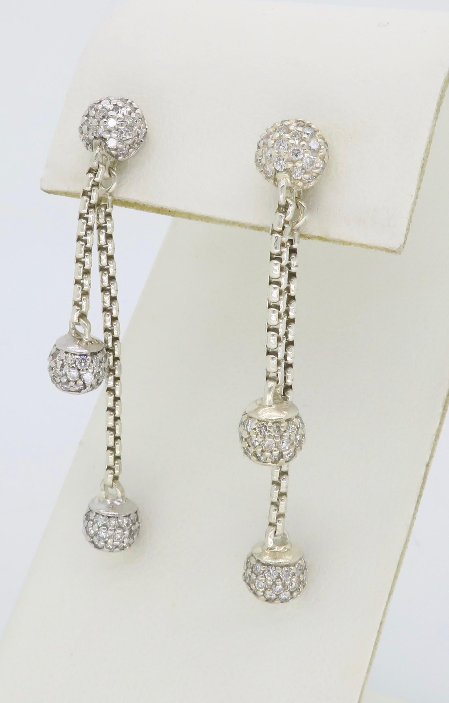 Double stranded diamond dangle earrings by designer David Yurman crafted in Sterling silver with 18K yellow gold accents.

Designer: David Yurman 
Diamond Carat Weight: Approximately 1.50CTW 
Diamond Cut: Round Brilliant Cut Diamonds
Color: Average