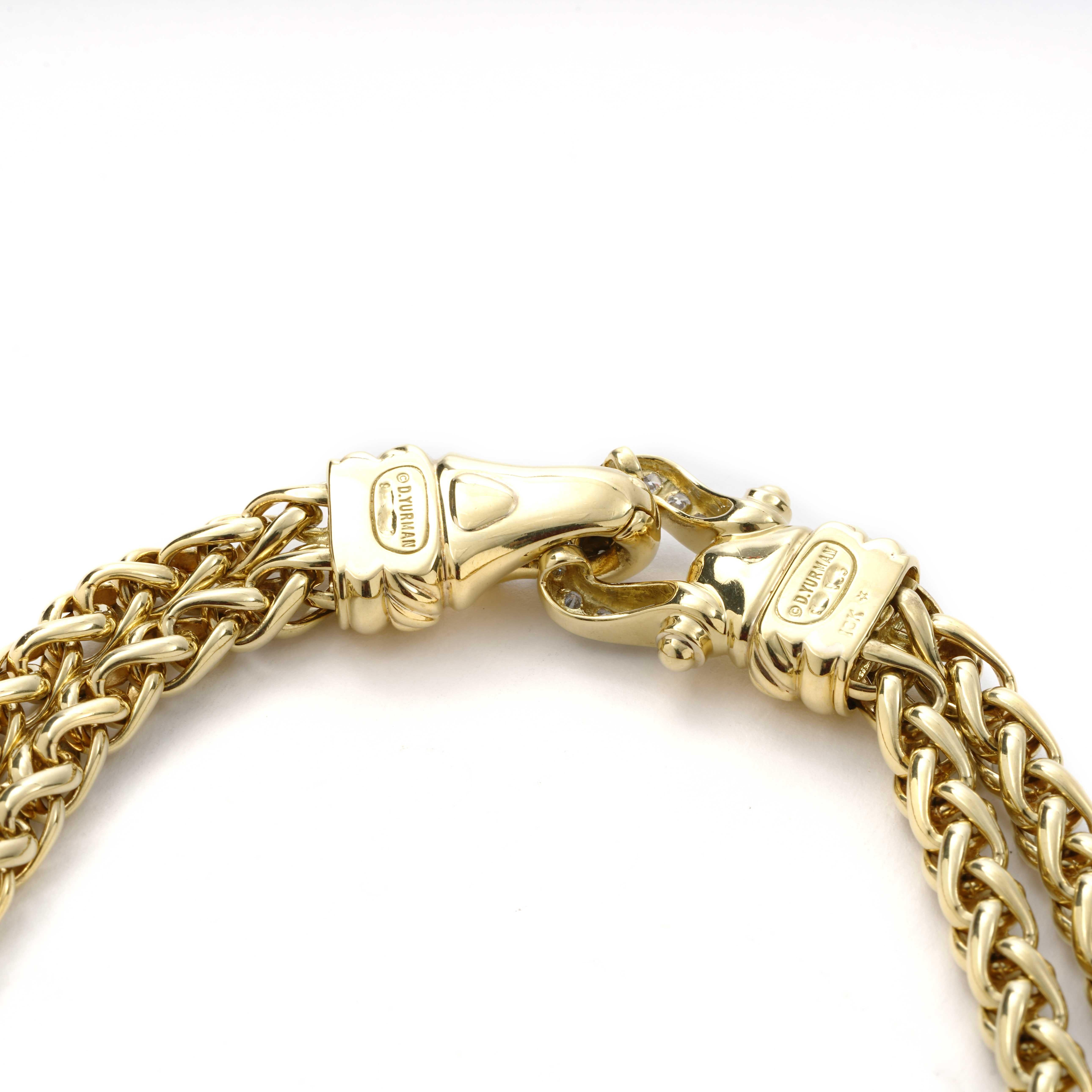 Retired, and previously owned David Yurman necklace. The necklace is 16 inches in length, made of 18K yellow gold. It also has 21 round F/G-color, VS-clarity diamonds weighing 1.10 CTTW.
