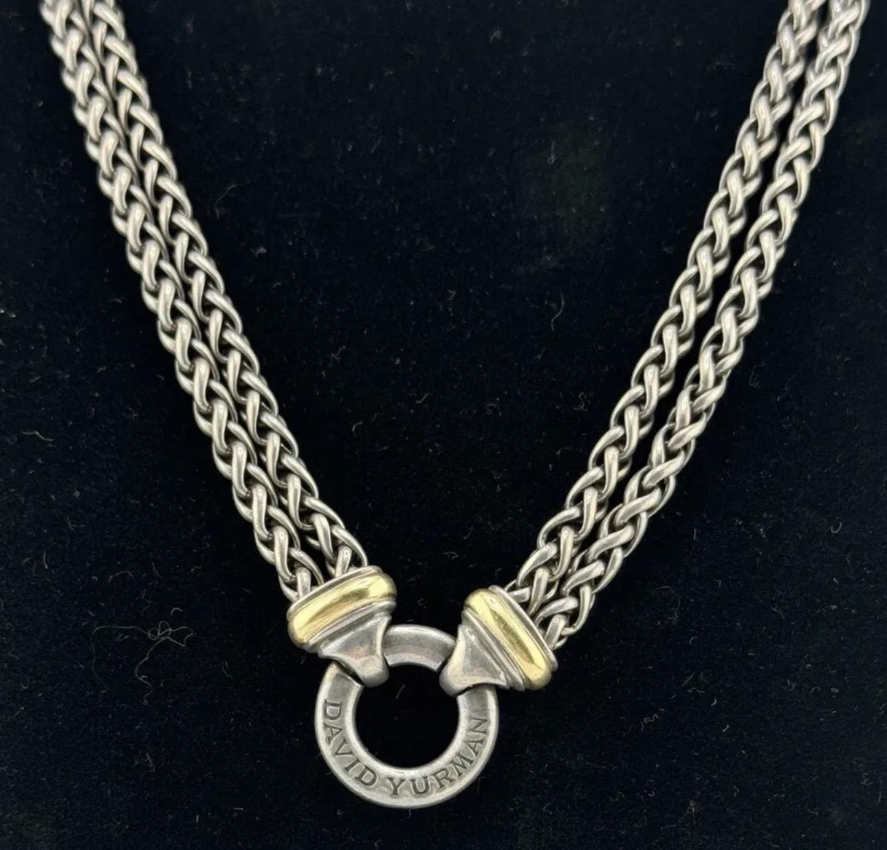 This David Yurman necklace features a double wheat chain design with alternating links in sterling silver . The chain is perfect for adding a touch of luxury to any outfit. The brand, David Yurman, is known for their high-quality jewelry and this