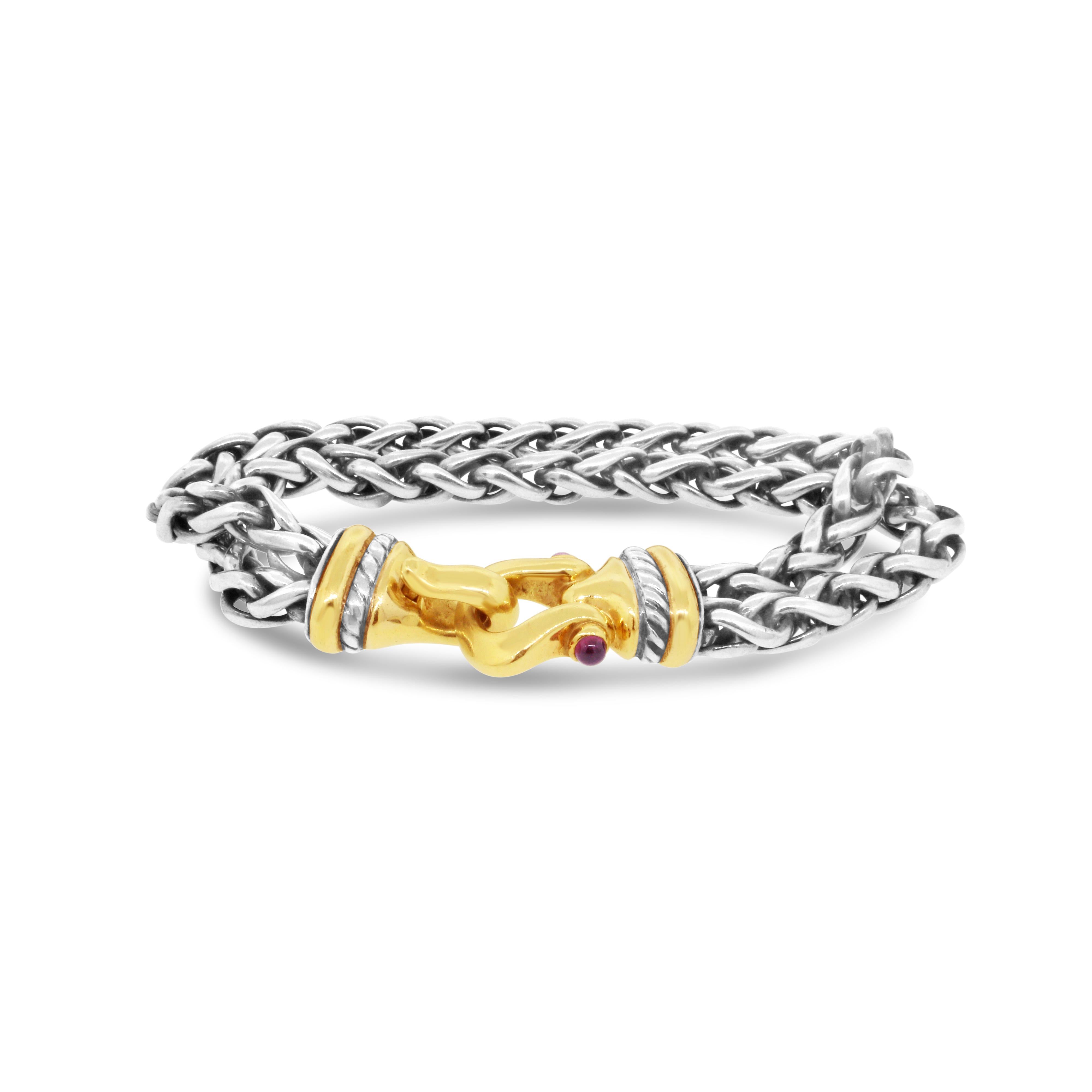 Sterling Silber und 14 kt Gelbgold
Edelstein: Rhodolith-Granat
Gesamtgewicht: 53 Gramm
Handgelenk Größe: 7,5 Zoll
Gebrauchtes