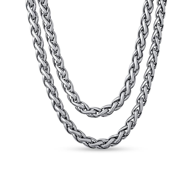 This necklace from David Yurman features a sterling silver double wheat necklace with 14 karat yellow gold buckle clasp. The buckle clasp features two tourmaline cabochons. 
Measurements: Length approximately 16
