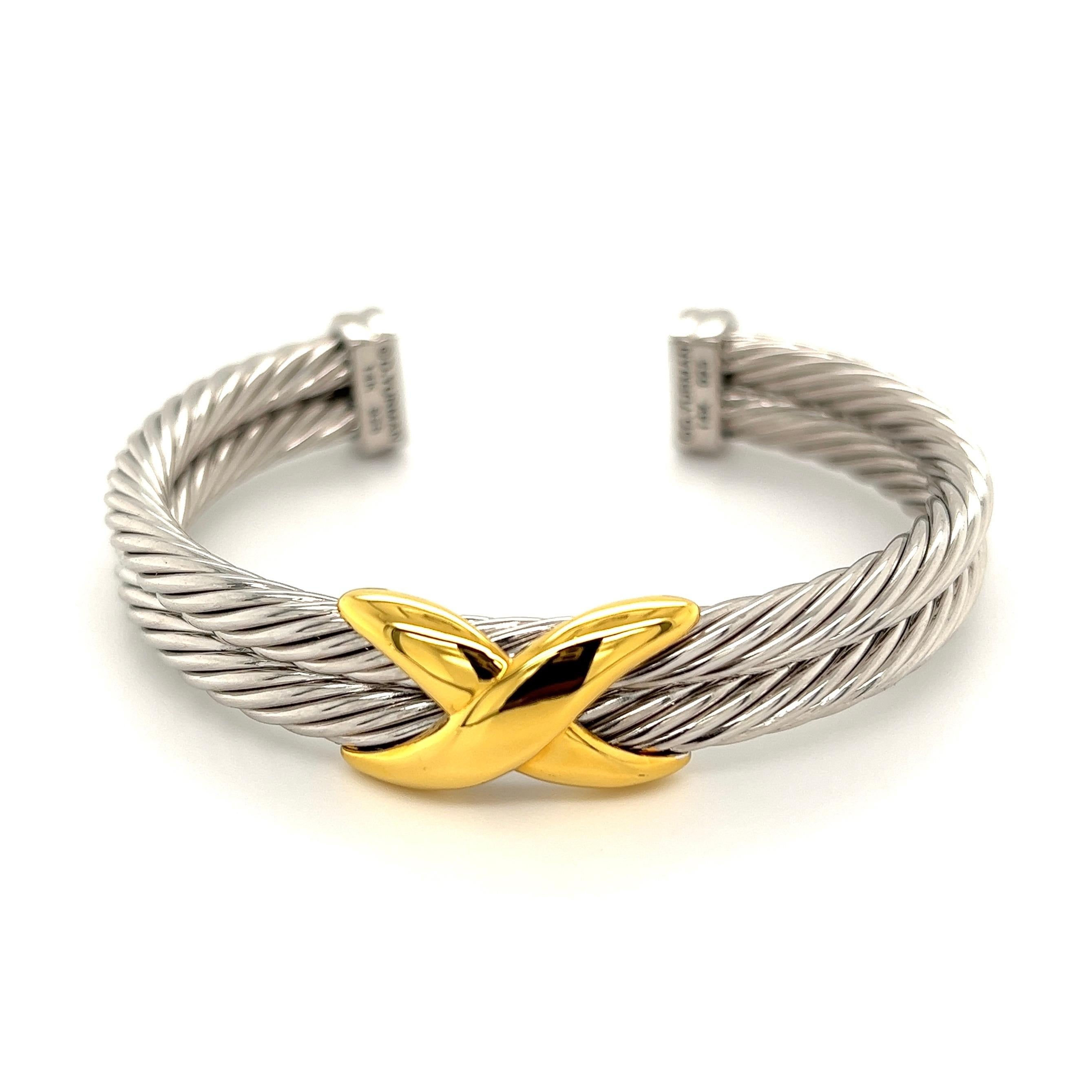 Iconic David Yurman Gold and Sterling Silver Double Cable X Cuff Bangle Bracelet. Hand crafted in 14K Yellow Gold and Sterling Silver. Opening for convenient slipping off and on. Chic and Stylish…A sure to be admired Striking and Classic Fashion