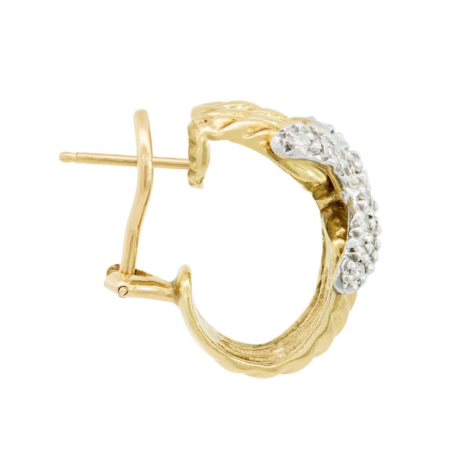 A striking pair of Estate earrings from renowned jewelry designer David Yurman! These fabulous earrings are crafted in 14k yellow gold, and the surface of each earring is decorated with a ribbed texture commonly incorporated into David Yurman