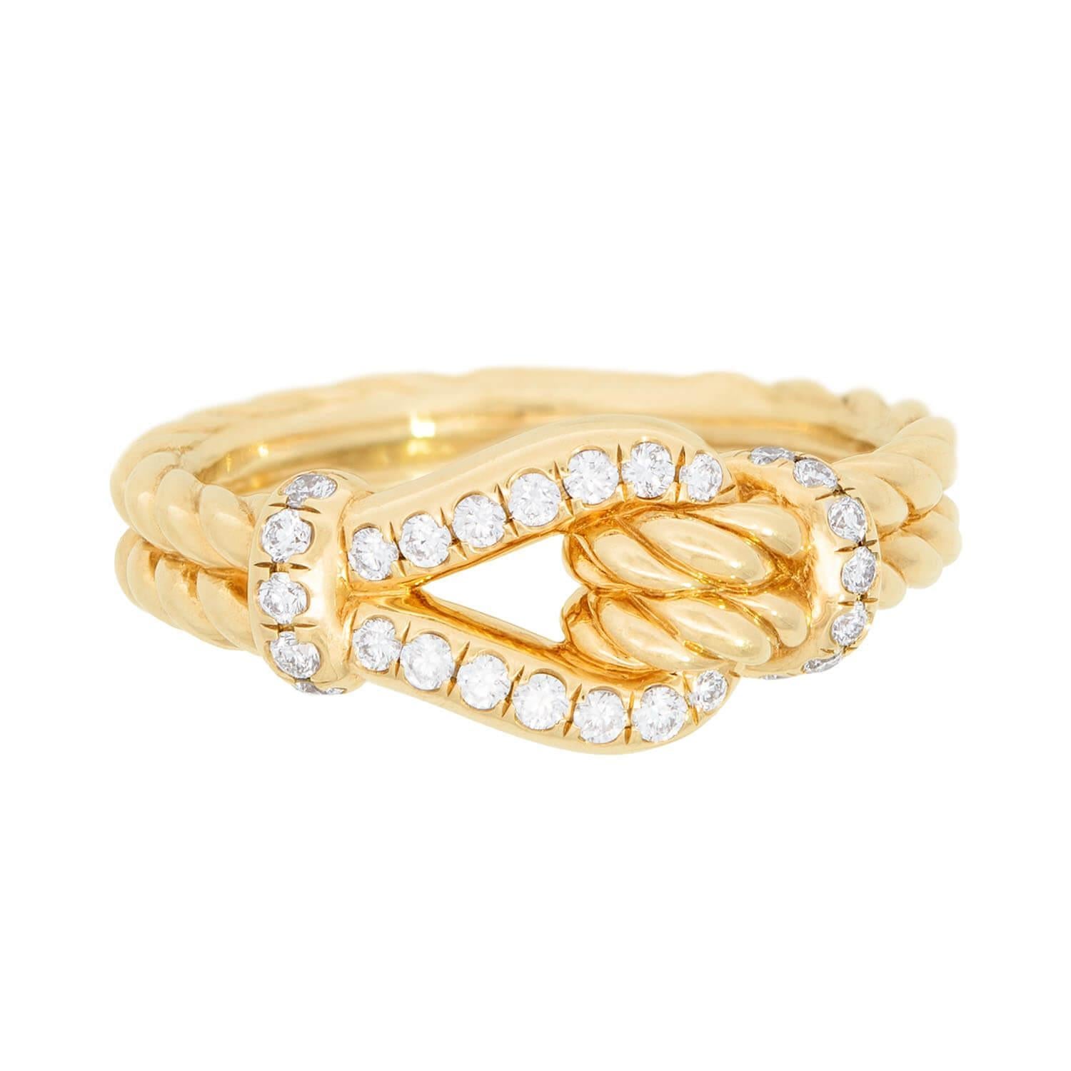 A striking Thoroughbred ring from renowned jewelry designer David Yurman! This fabulous ring is crafted in 18k yellow gold and incorporates an equestrian-hardware design similar to that of a bridle clasp. The band has a rope-like texture, and the