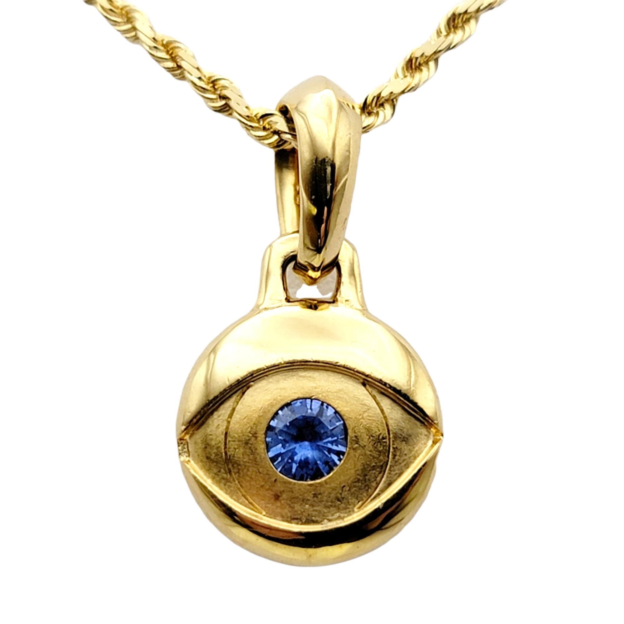 Gorgeous modern pendant by David Yurman featuring the evil eye motif. A single round blue sapphire is set at the center of a brushed and polished 18 karat yellow gold 'eye'. 

*Please note this listing is for the pendant only. No necklace or cord is