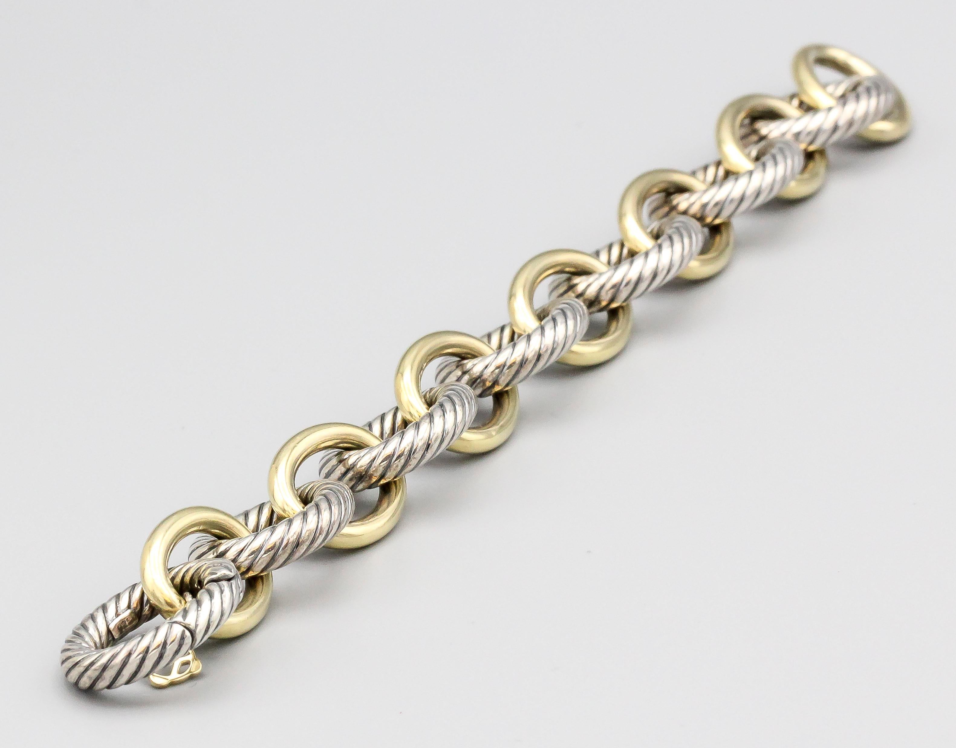 Chic extra large sterling silver and 18k yellow gold oval link bracelet by David Yurman. Current retail approx. $2100. Comes with original pouch.