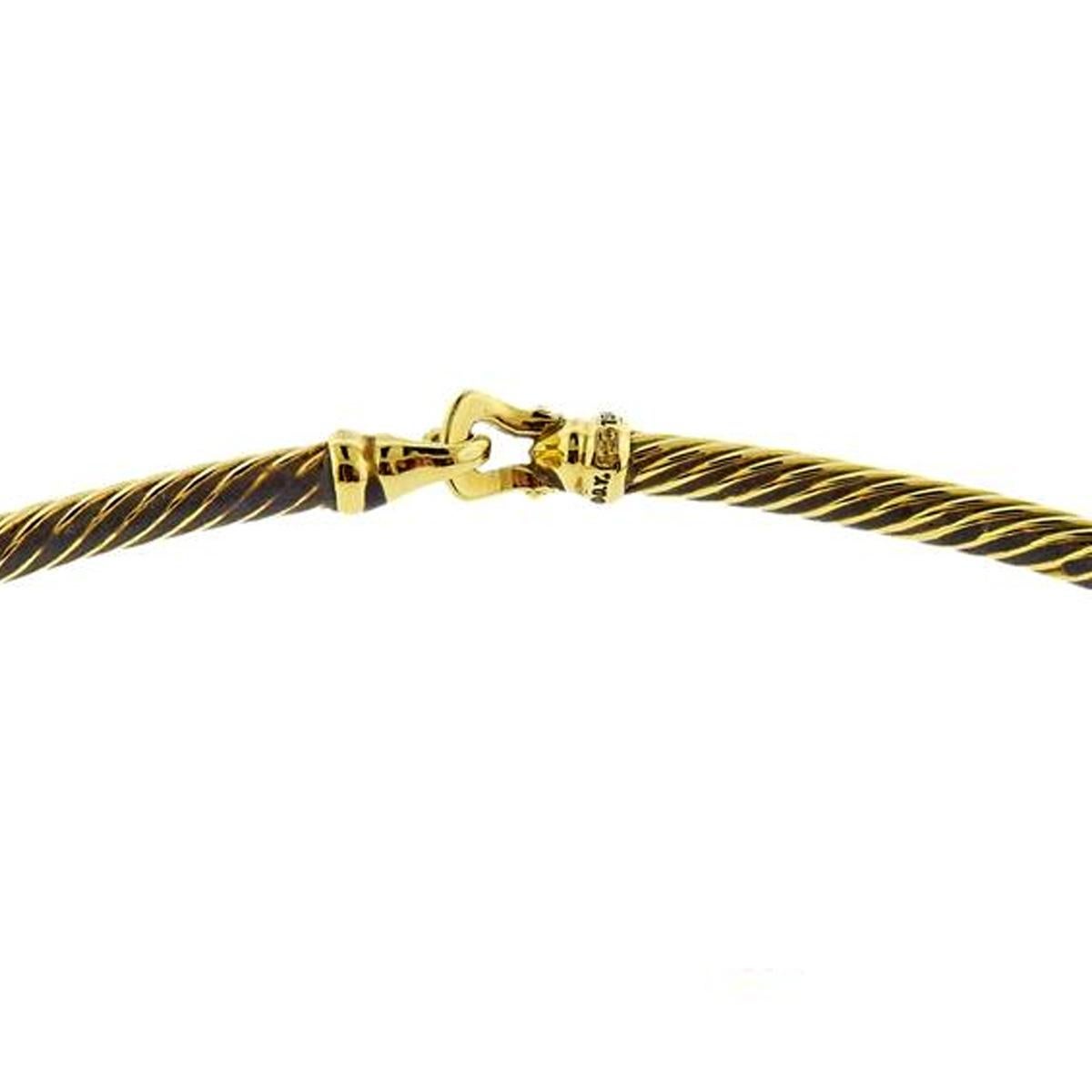 A chic David Yurman choker necklace crafted in 18k yellow gold. The necklace measures 4mm wide and has a length of 15.5
