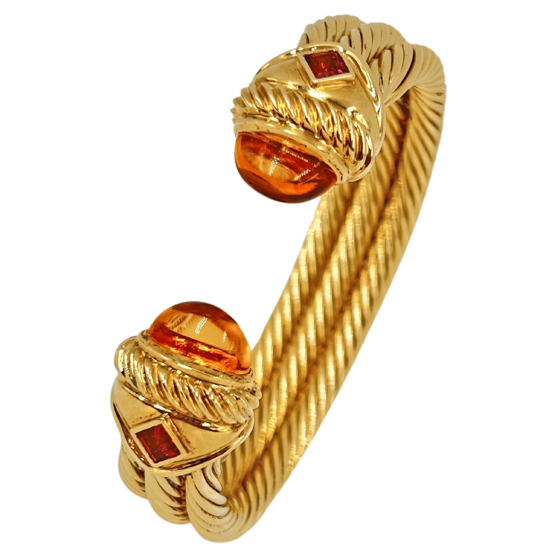 David Yurman iconic cable design bracelet in yellow gold with citrine and garnet gemstones.  Triple twisted gold cable, accented by two square, step-cut 4mm rhodolite garnets, and 13 x 5mm citrine cabochons, bezel set as end caps.  Polished finish.