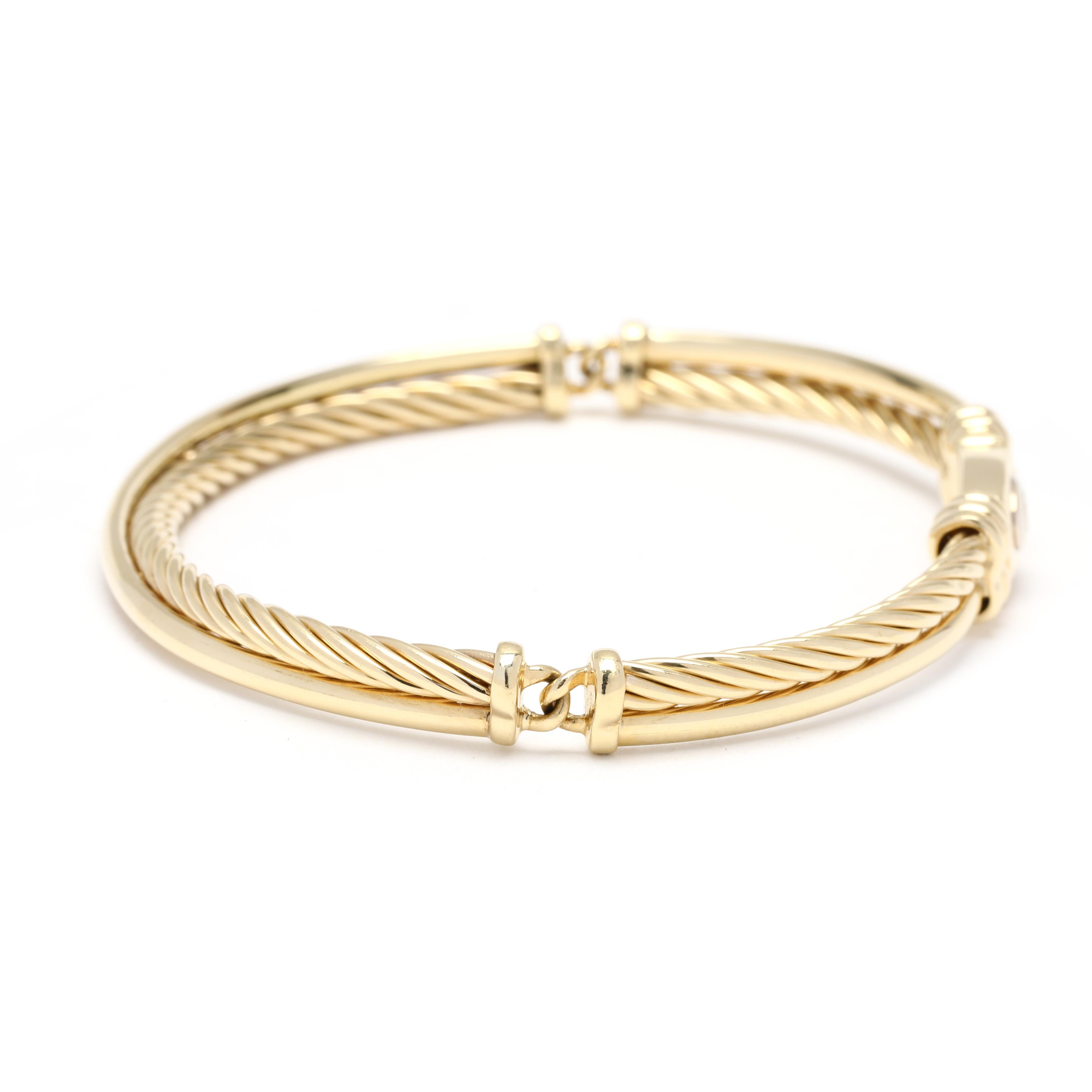 This glamorous David Yurman 18K gold bangle bracelet is sure to become one of your favorite pieces of jewelry. Crafted from 18K yellow gold, this elegant bracelet features a classic crossover cable design that is perfect for wearing with casual or