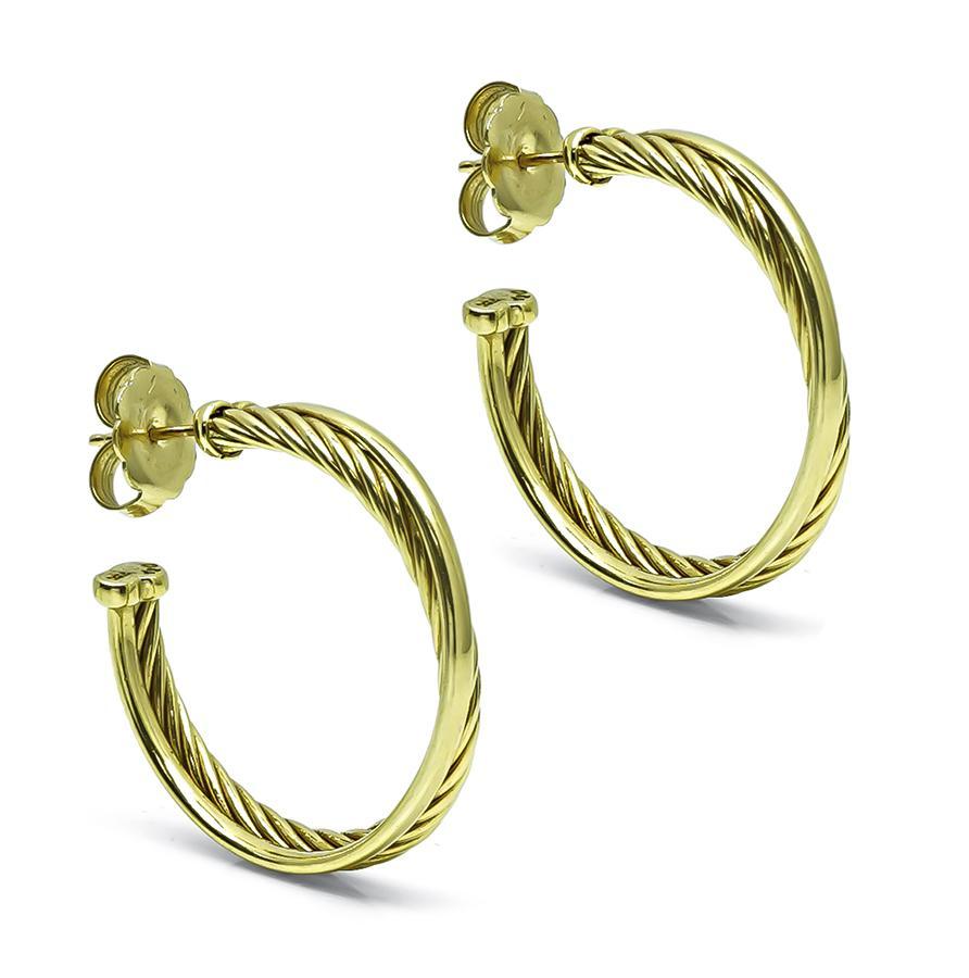 This is a magnificent pair of 18k yellow gold earrings by David Yurman. The earrings measure 31mm by 5mmmm and weigh 13.8 grams. The earrings are signed DY 750.