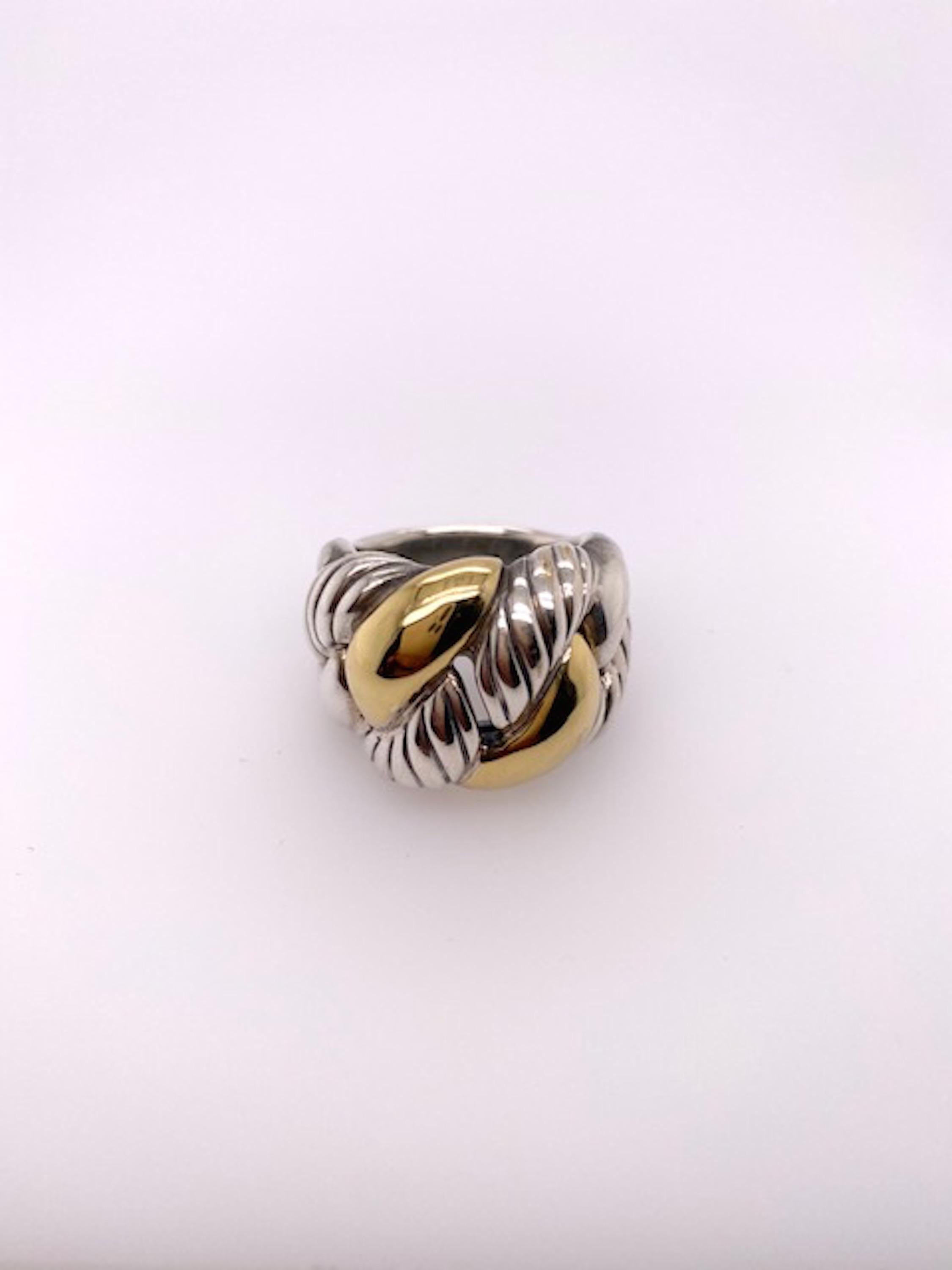 Large crossover ring.  Made and signed by David Yurman. Interlocking circles of heavy gauge sterling silver and 18K yellow gold.  Size 8 and can be custom-sized. The top of the ring measures approximately 1 1/4
