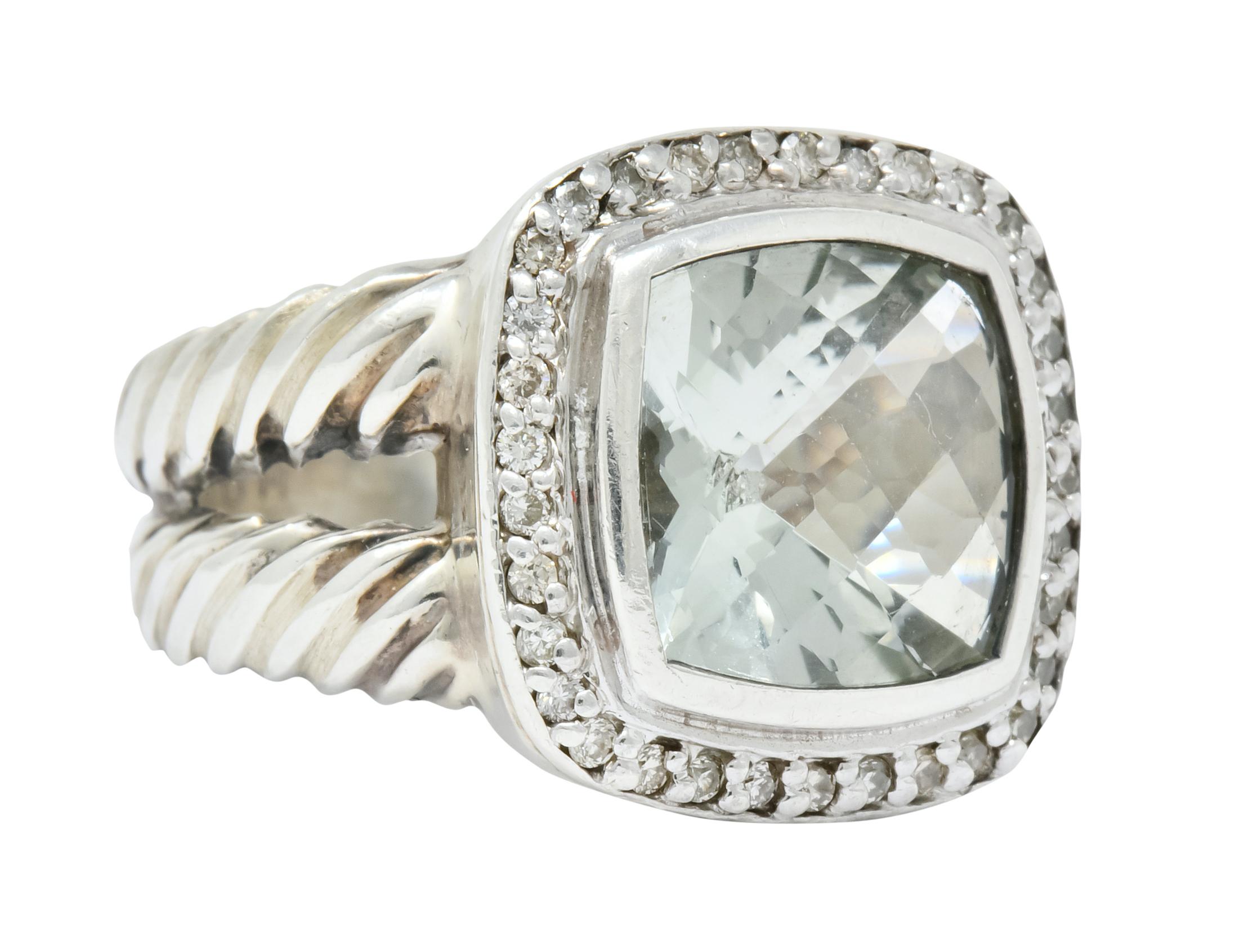 Centering a square green quartz that is faceted and bezel set in sterling silver

Bordered by numerous pave set white diamonds

Completed with cable twist double split sterling silver shank

Signed DY 925 

Top measures 15.5 mm wide and sits 5 mm