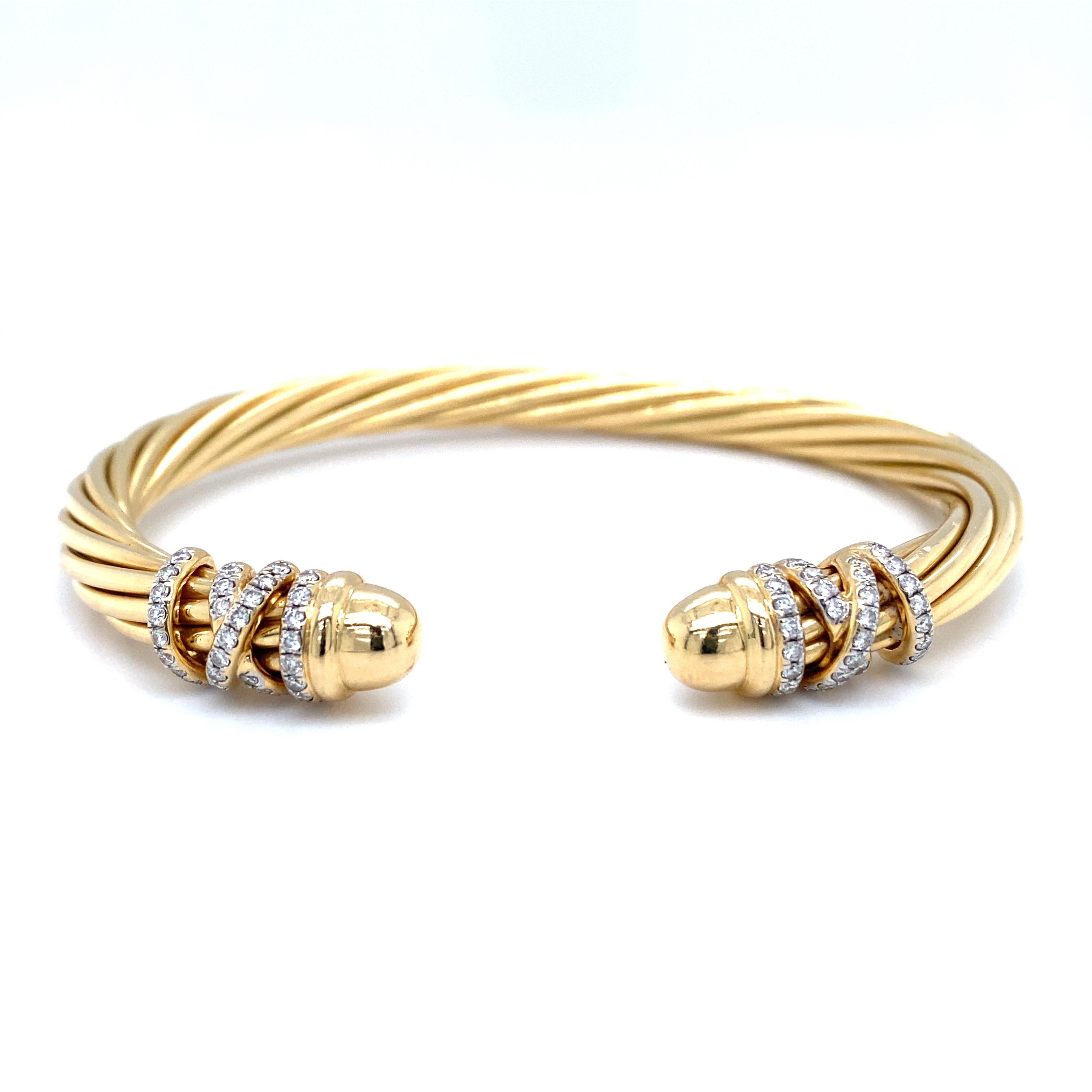 Item Details: This cuff bracelet by David Yurman is the iconic Helena design. It features a unique twisted gold design with wrapped accent studded with diamonds. This bracelet has over half a carat of round diamonds and has domed ends.

This