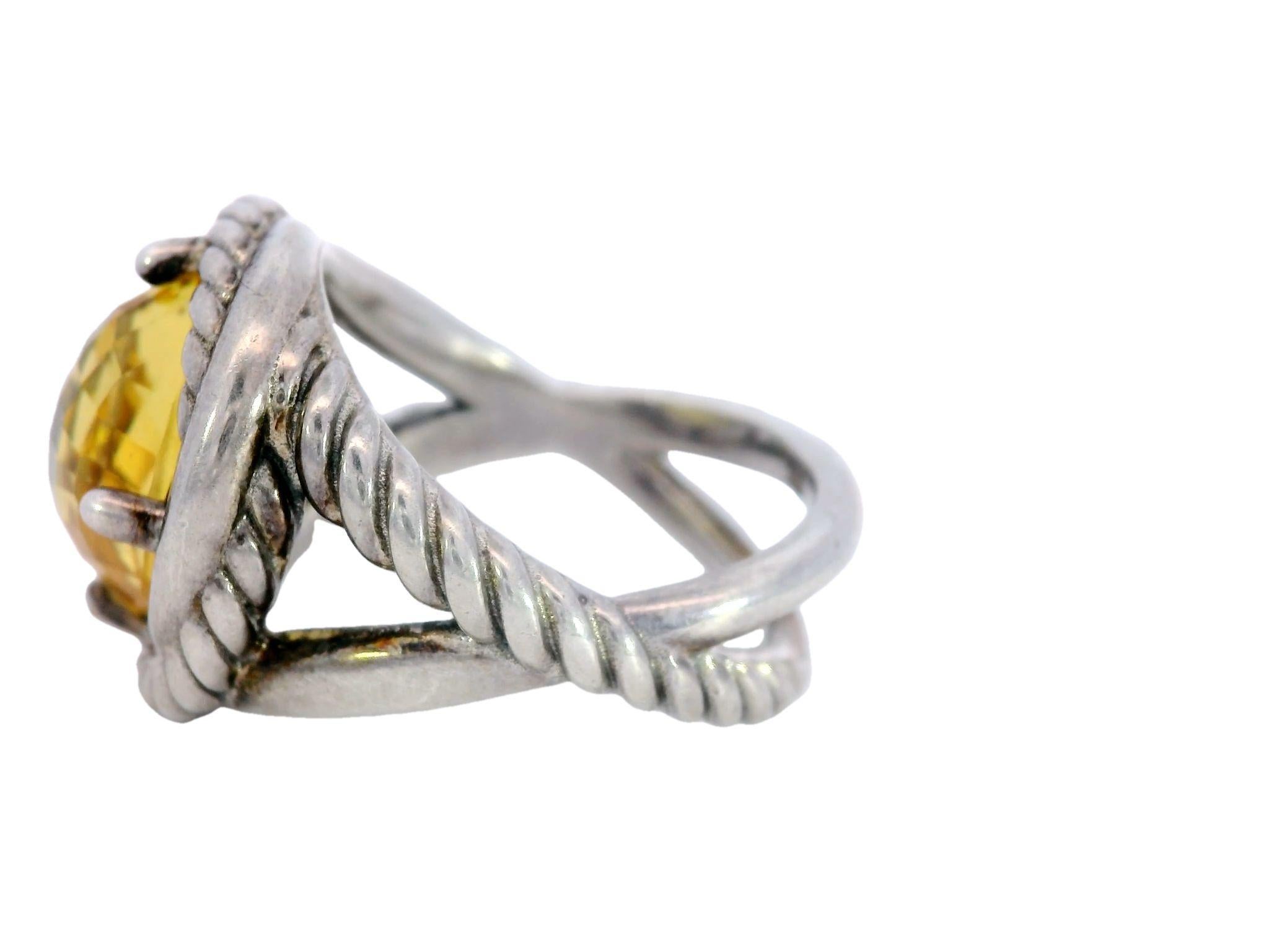 David Yurman Yellow Citrine Infinity Ring with Sterling Silver

This modern David Yurman ring made from sterling silver, features a bright yellow citrine gemstone at the center. The citrine is cushion-cut, weighing 4.27 carats, and its vibrant