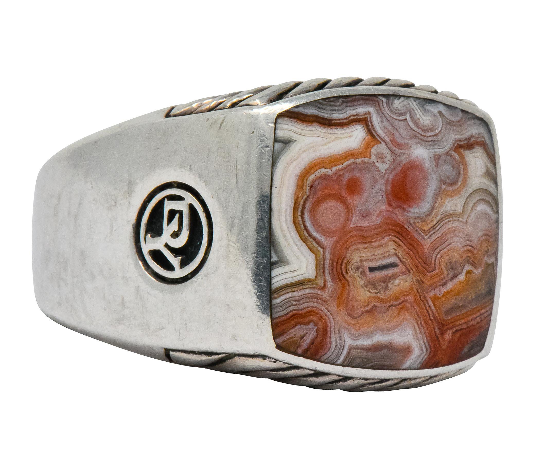 Centering an inlaid square slice of jasper, opaque with pink, red, and brown banding and good polish

Accompanied by ribbed silver pattern on profile faces

From David Yurman's Exotic Stone collection

Silver maker's mark on shoulder

Stamped 925
