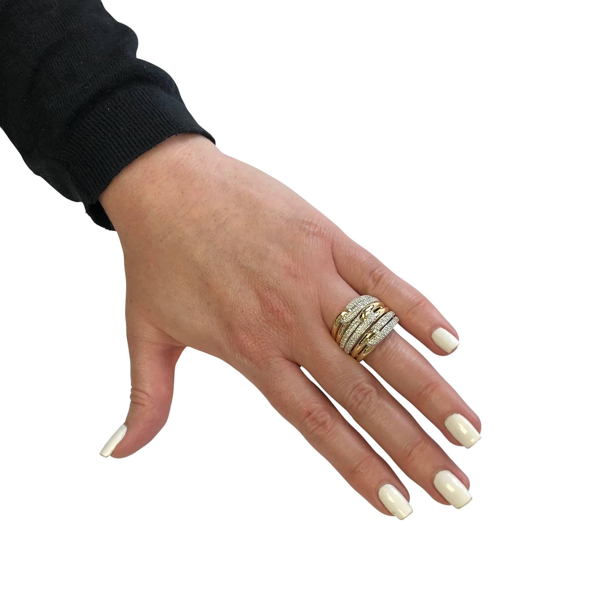 David Yurman Labrynth Triple-Loop Ring crafted in silver and 18K yellow gold with pave set diamonds and twisted rope detail. This stunning ring measures 19.3mm wide and tapers to 8.07mm. Size 8

Our pieces are all accompanied by an appraisal