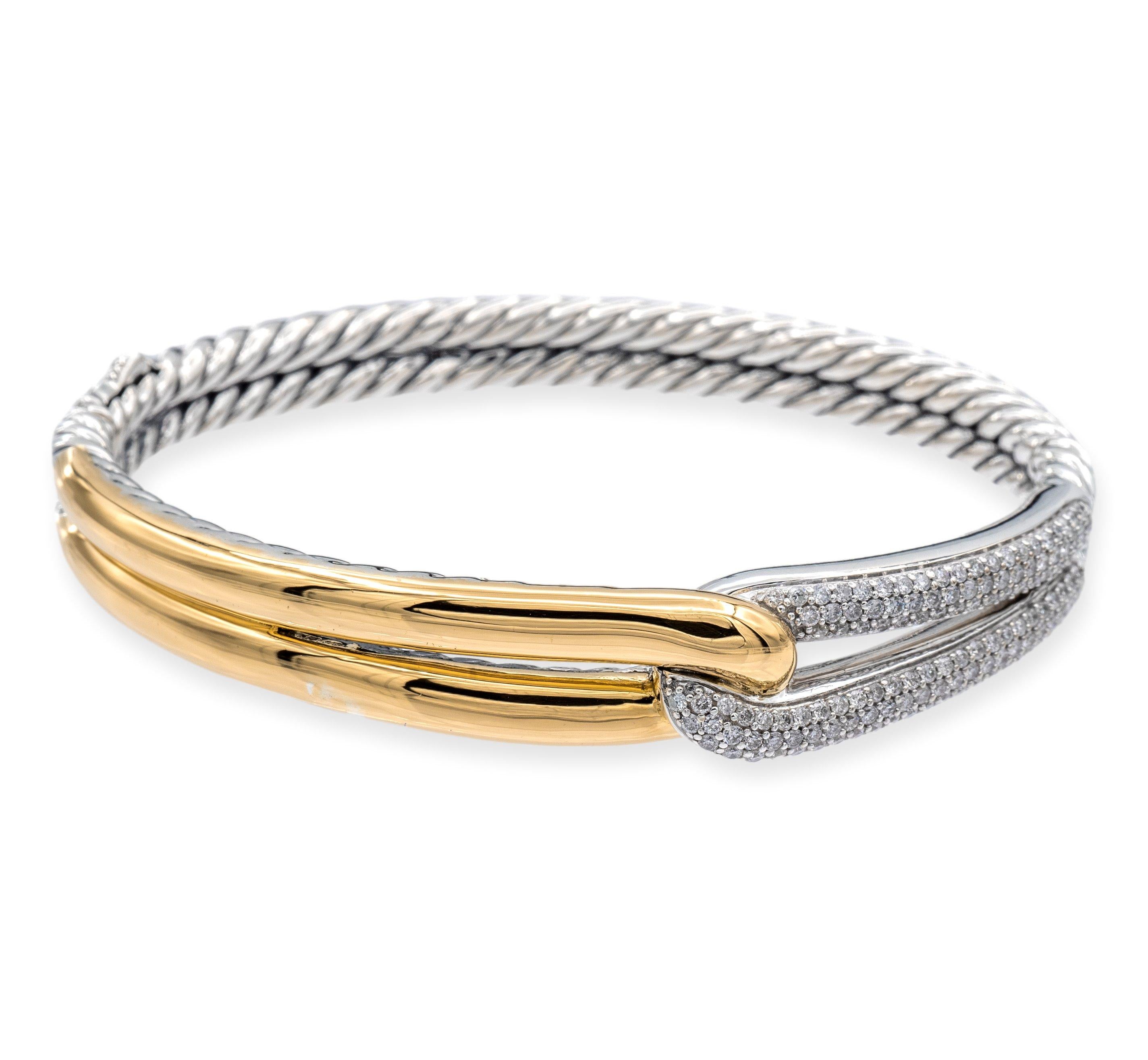 The David Yurman single loop bangle from the Labyrinth Collection is a beautiful blend of fine sterling silver and 18 karat yellow gold. Its smooth cable design and push button closure create a sleek and sophisticated look set with round brilliant