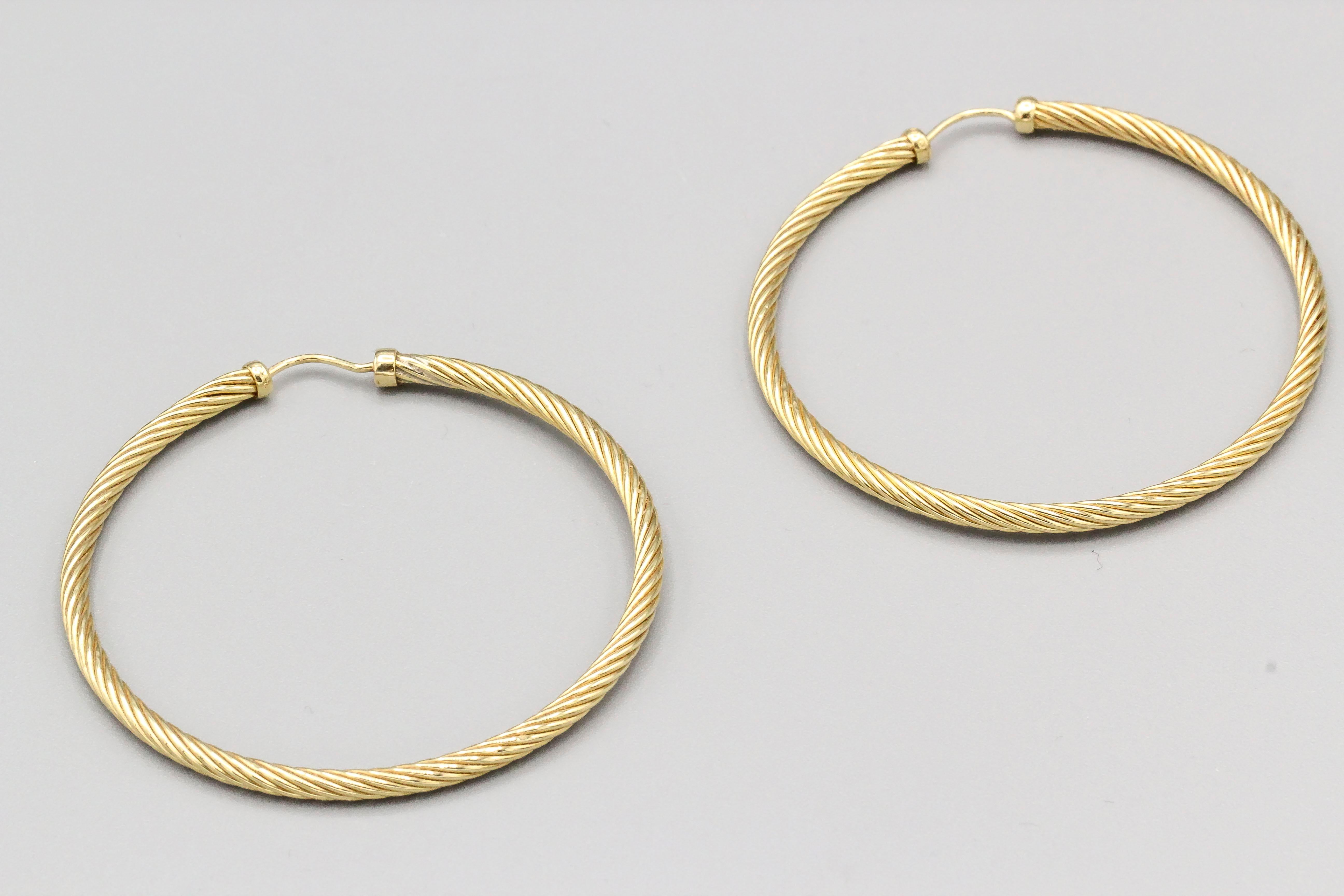 Fine large 18k gold cable hoop earrings by David Yurman. Approx. 2.25 inches in diameter, bigger than the current model sold.

Hallmarks: DY 750