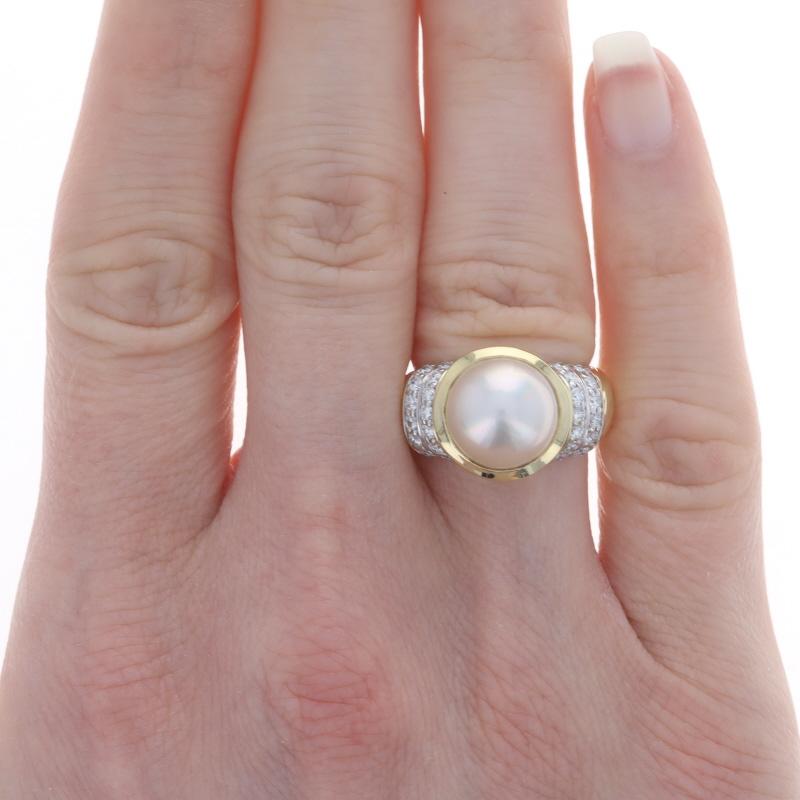 Retail Price: $4000

Size: 5

Brand: David Yurman

Metal Content: 18k Yellow Gold & 18k White Gold

Stone Information
Mabe Pearl
Size: 10mm

Natural Diamonds
Carat(s): .60ctw
Cut: Round Brilliant
Color: G - H
Clarity: VS1 - VS2

Total Carats: