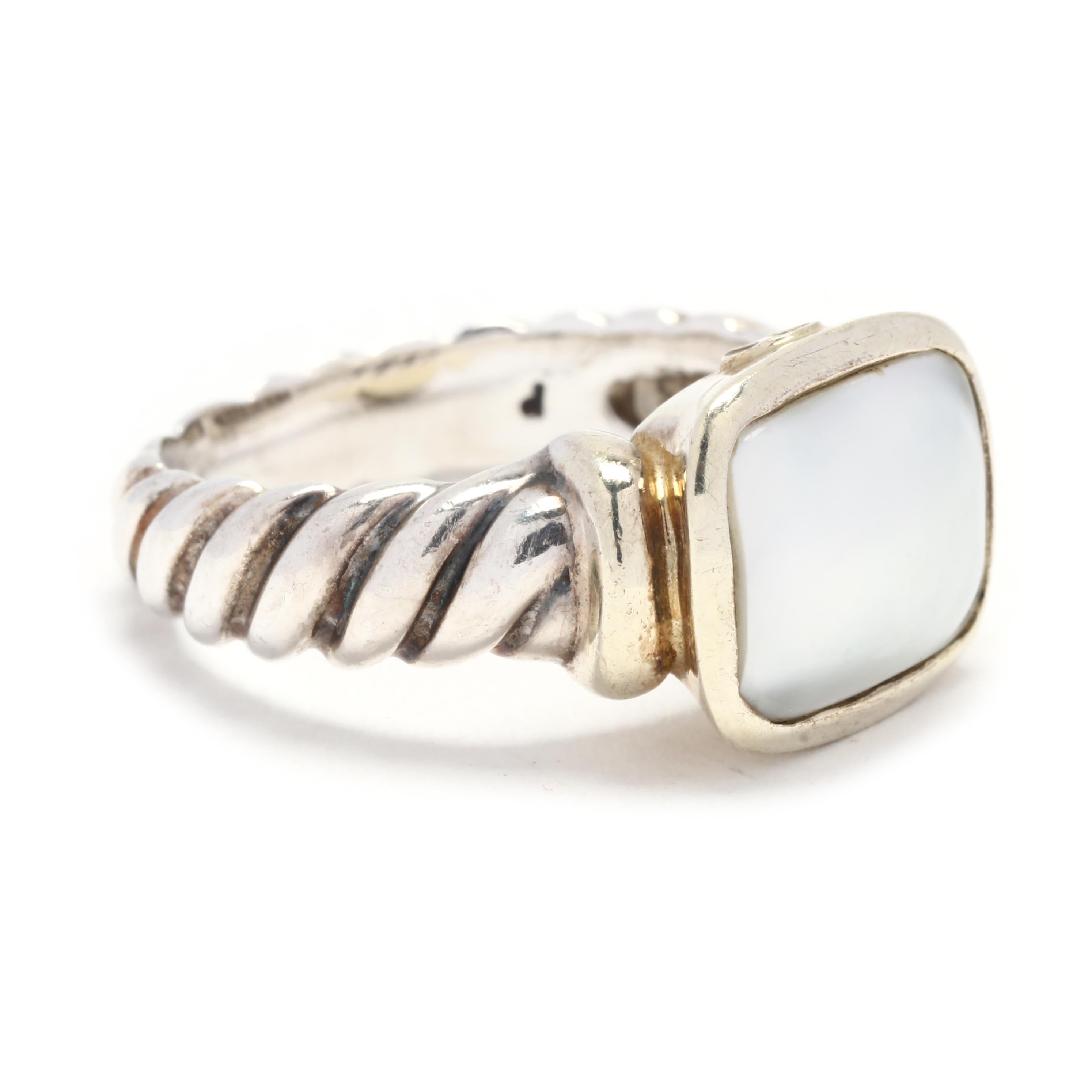 This David Yurman Mabé Pearl Noblesse Ring is a stunning and elegant piece of jewelry. Made from 14K yellow gold and sterling silver, it combines luxurious materials to create a beautiful look. The ring features a large mabé pearl in the center,