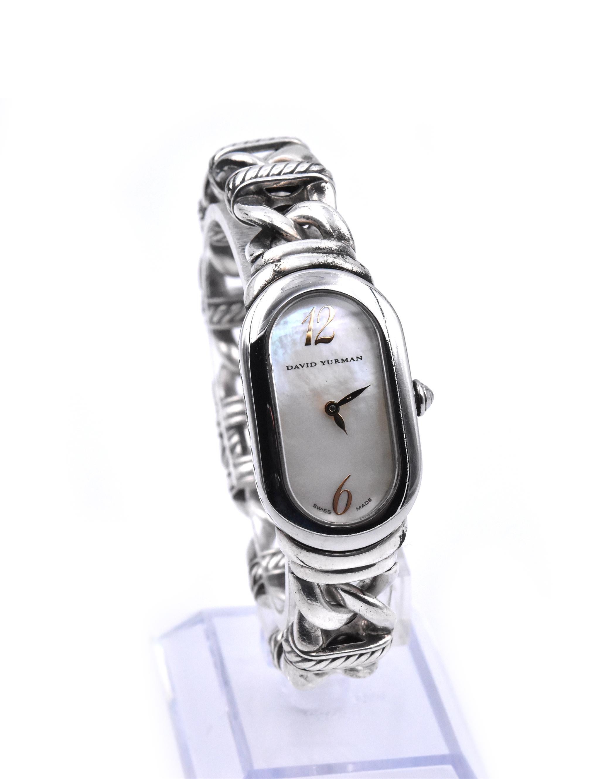 Movement: quartz
Function: hours, minutes
Case: stainless steel 41mm case, stainless steel fixed bezel, sapphire protective crystal, pull/push crown
Band: sterling silver cable bracelet, bracelet will fit 7-inch wrist
Dial: mother of pearl dial with