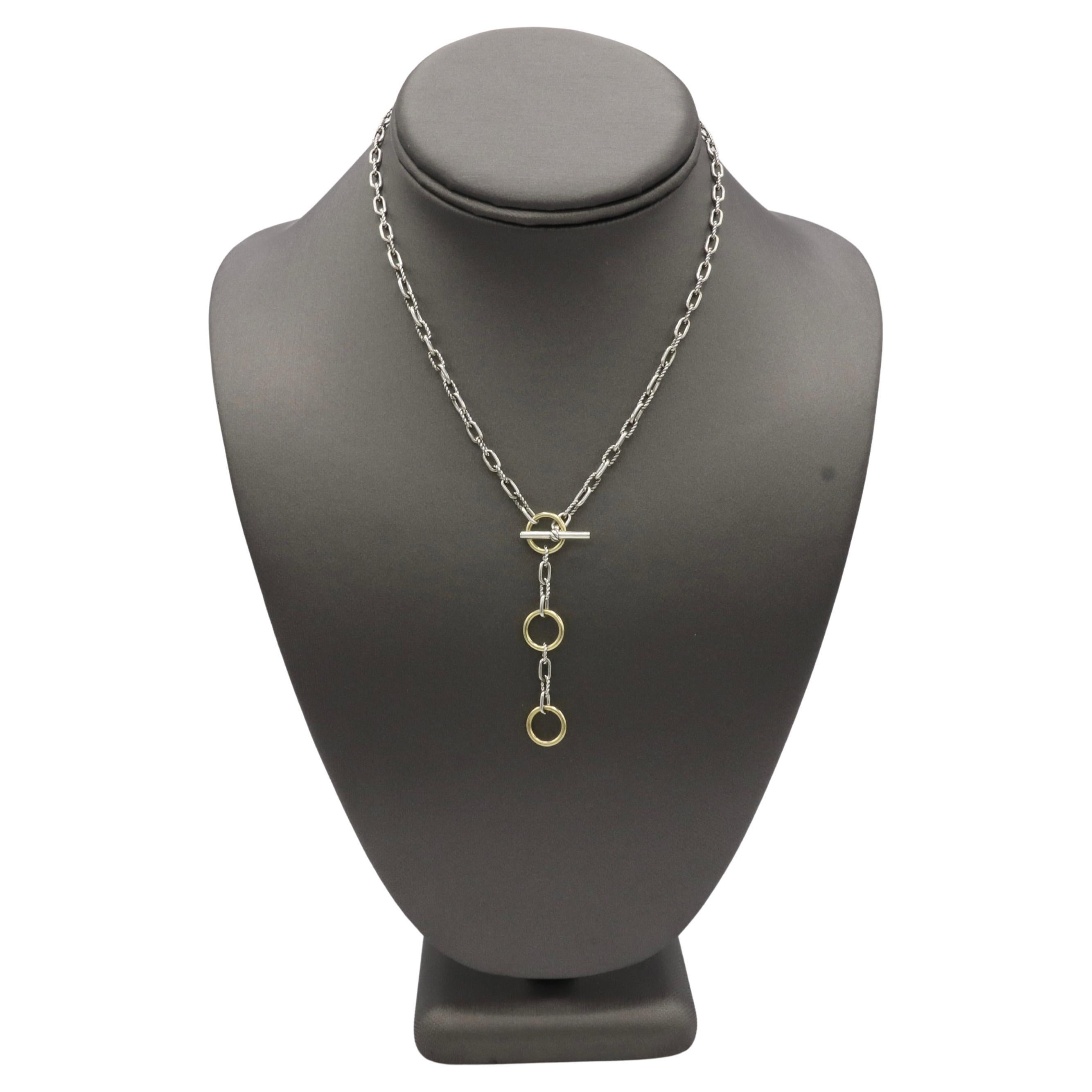 David Yurman Madison Sterling Silver & Gold Three-Ring Chain Toggle Necklace 
Metal: Stelring silver & 18k yellow gold
Weight: 10.69 grams
Length: 17 inches
Drop: 2.25 inch
Retail: $850 USD
