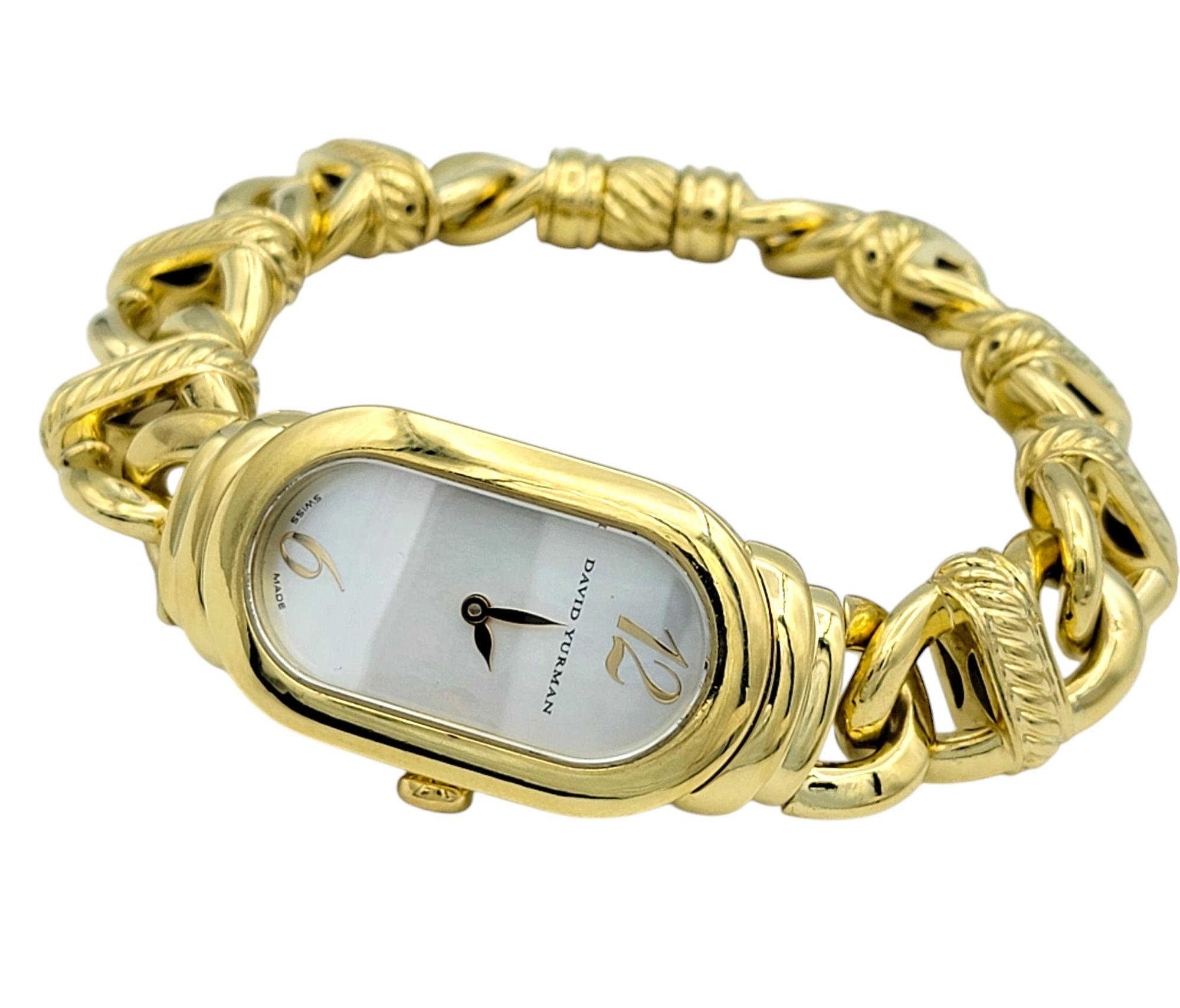 Embodying the essence of sophistication, this David Yurman Madison wristwatch is a true statement of luxury. Crafted in radiant 18 karat yellow gold, the sleek, elongated case is complemented by Yurman’s signature cable twist detailing, adding a