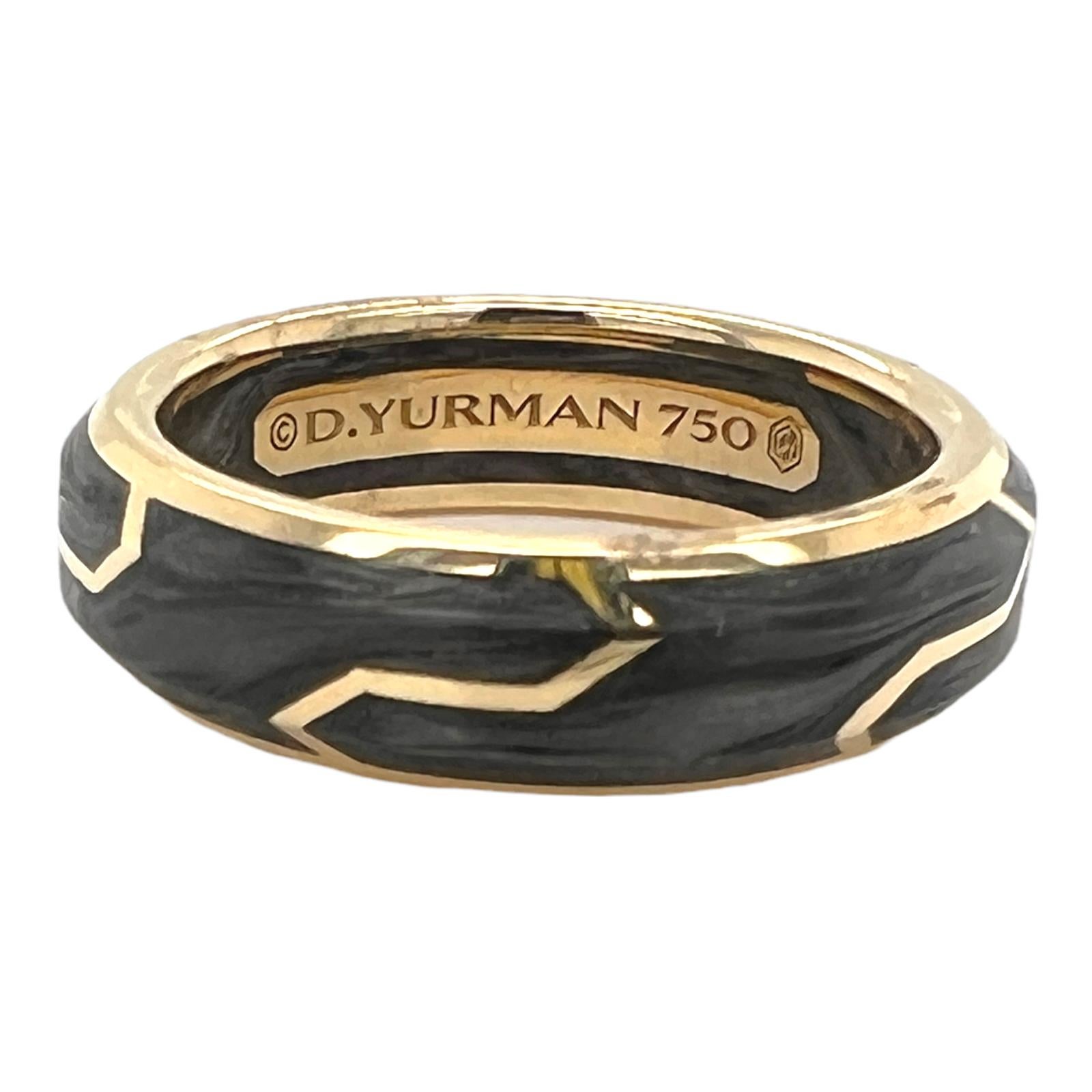 David Yurman Gents modern band ring crafted in 18 karat yellow gold and forged carbon. The band measures 6mm in width, and is size 8. Signed D. Yurman 750.
