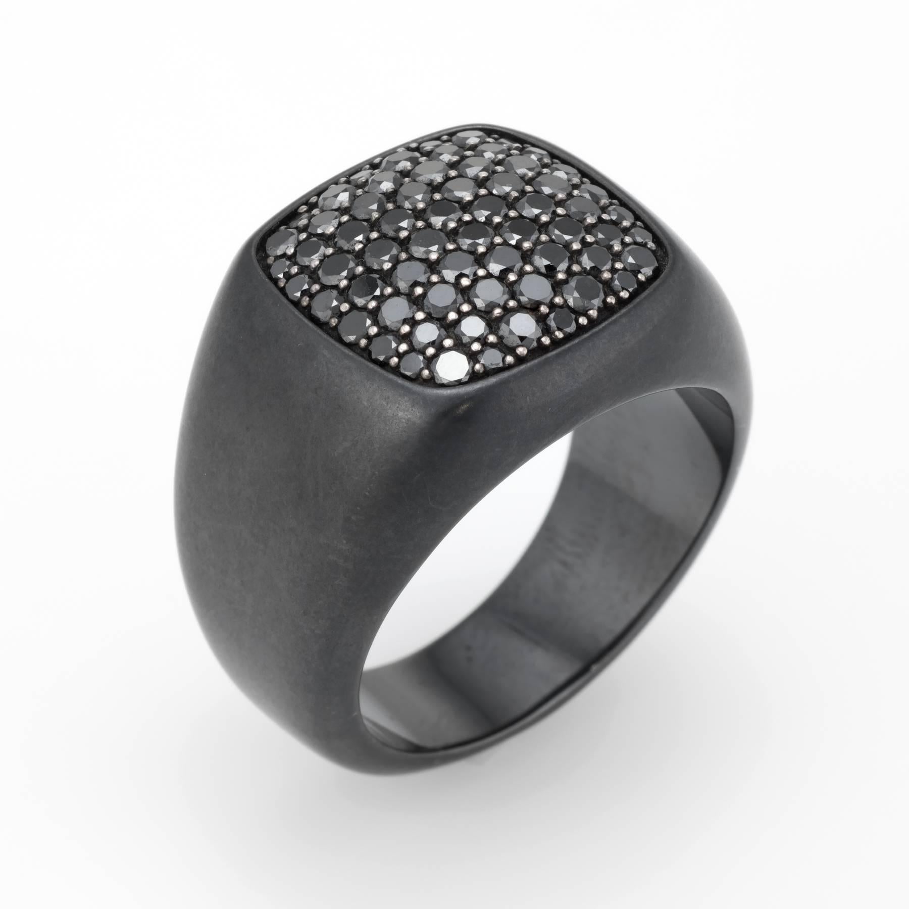 Finely detailed pre owned David Yurman men's signet ring, crafted in sterling silver and titanium. 

Pave set black diamonds total an estimated 1.82 carats. The diamonds are in excellent condition and free of cracks or chips.   

The ring retailed