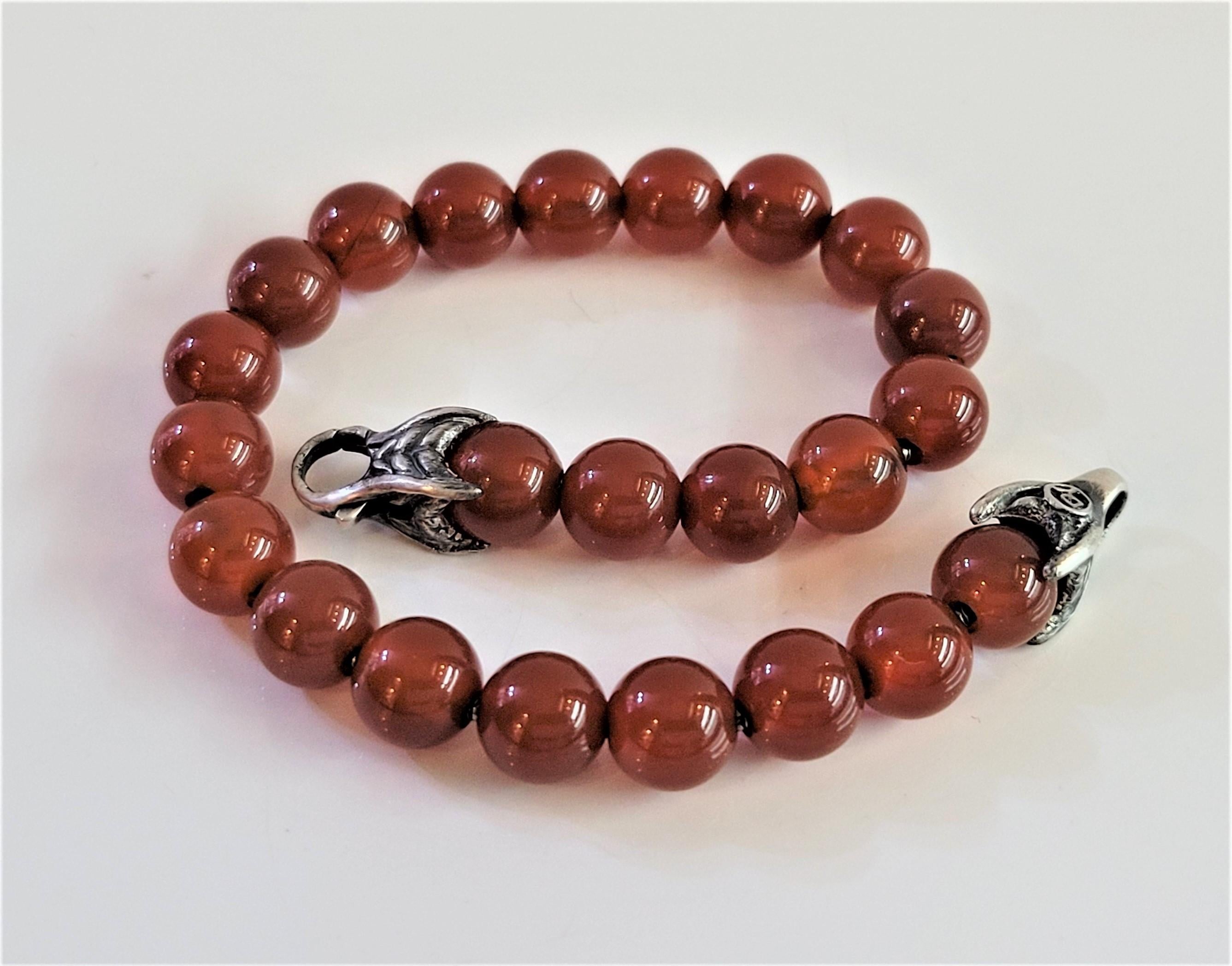 Brand David yurman 
Material Sterling Silver 925
Carnelian beads 8mm
Bracelet Length 8'' Long 
Condition New, never worn
Comes with David Yurman pouch