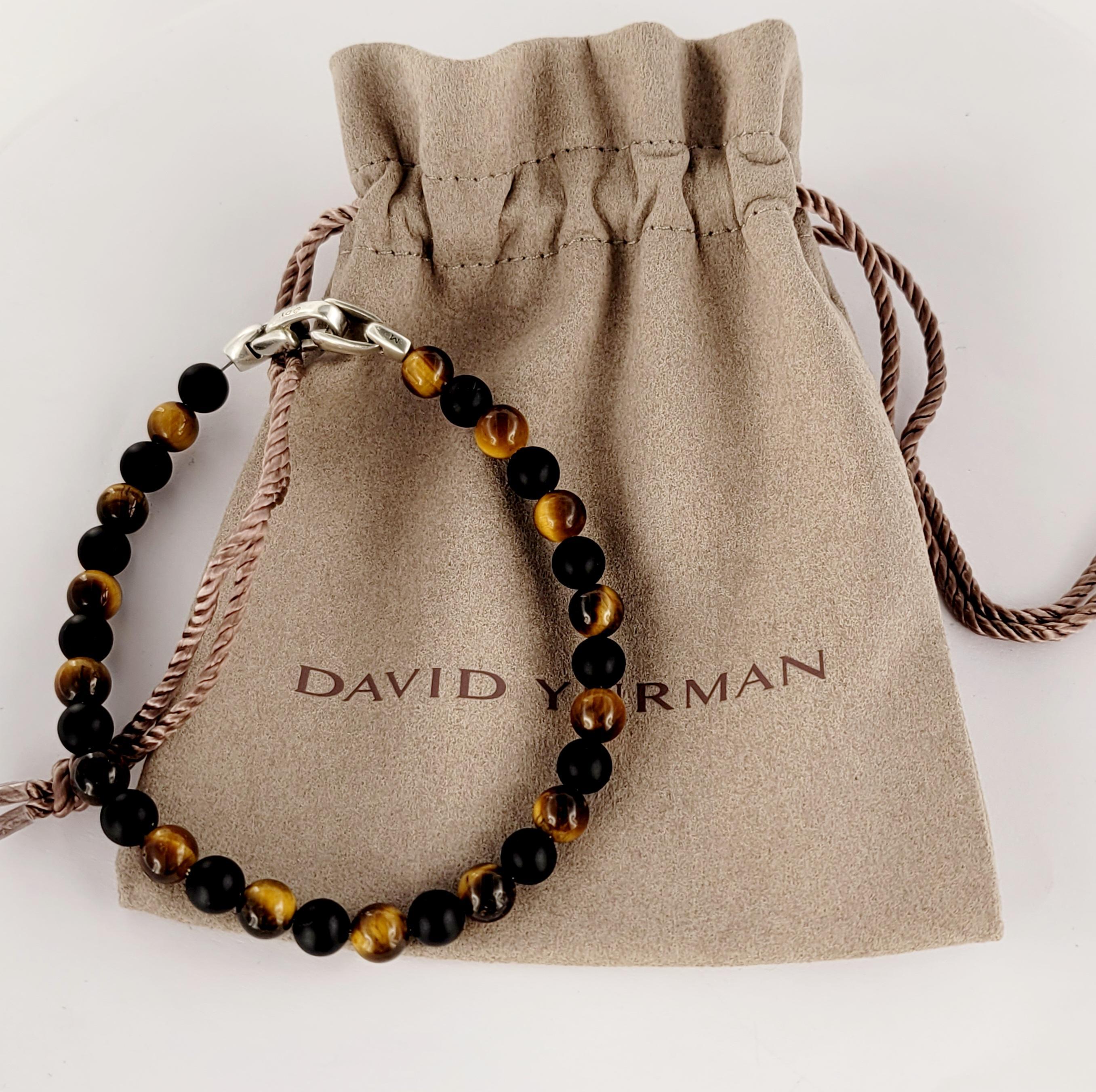 Bracelet de perles spirituelles pour hommes David Yurman
Style noir et œil de tigre 
Matériau Argent Sterling
Pureté du métal 925
Largeur du bracelet 6,5 mm
Longueur du bracelet 8.5'' d'un bout à l'autre
Poids du bracelet 13.2gr
Genre hommes
Condit