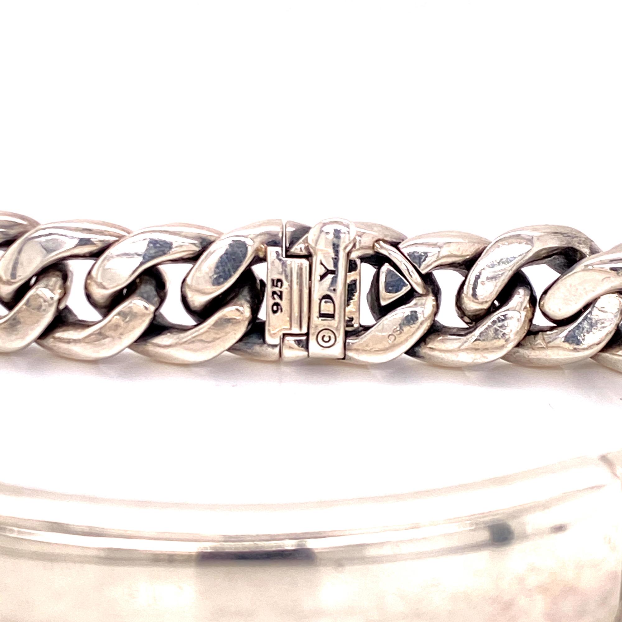 Sterling silver ID bracelet by David Yurman. The bracelet measures 8.25 inches in length and approximately .50 inches in width. Signed DY 925.