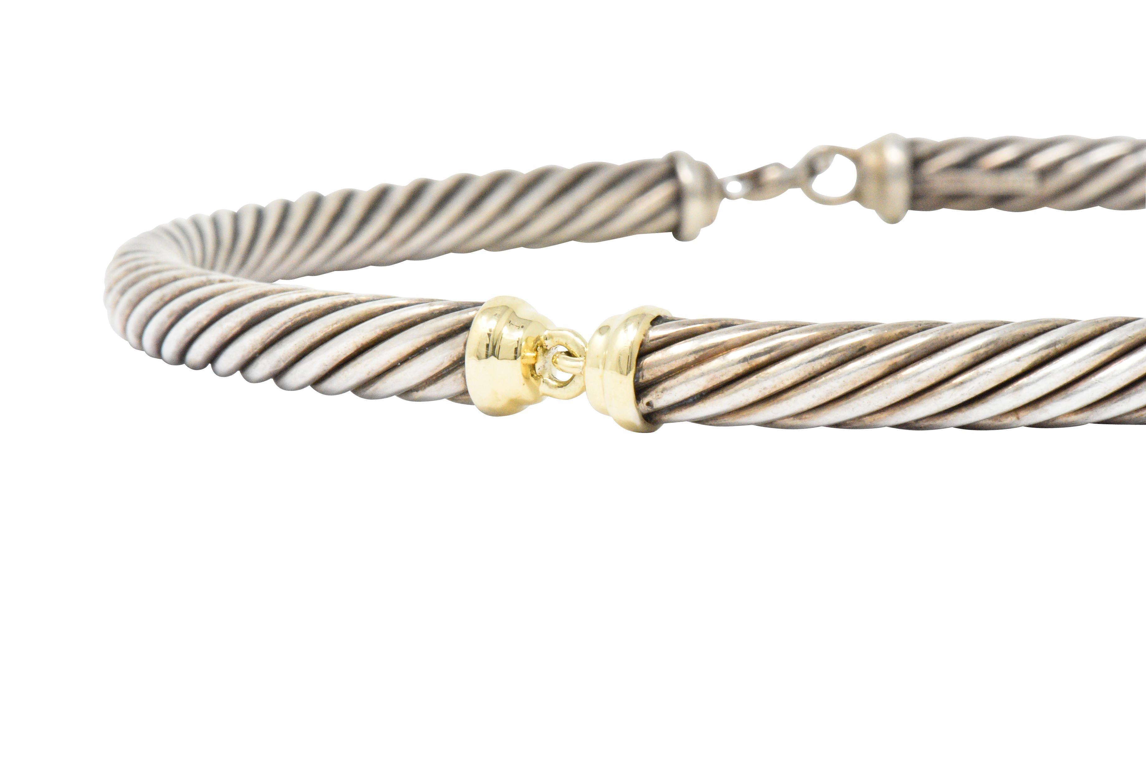 Collar style necklace in three segments

Centering polished silver and gold terminals 

Completed by twisted sterling silver segments and lobster style clasp

Signed D.Y.

Length: 15 inches

Width: 7.1 mm (widest)

Total Weight: 84.5