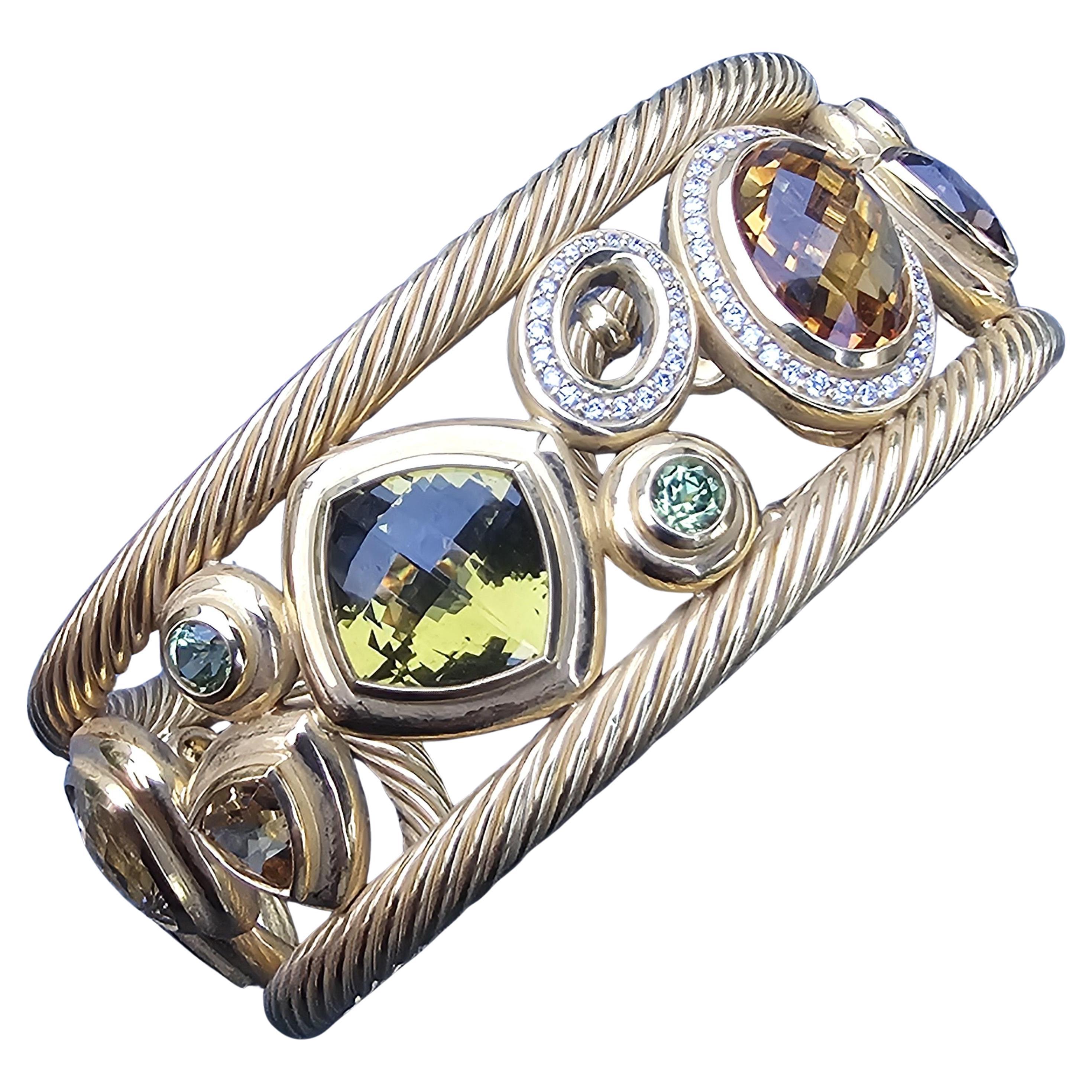 This exquisite David Yurman Mosaic cuff bracelet is a remarkable piece for any jewelry enthusiast. Crafted from 18k yellow gold, it showcases a captivating design with intricate twisted rope details. The bracelet is adorned with a variety of