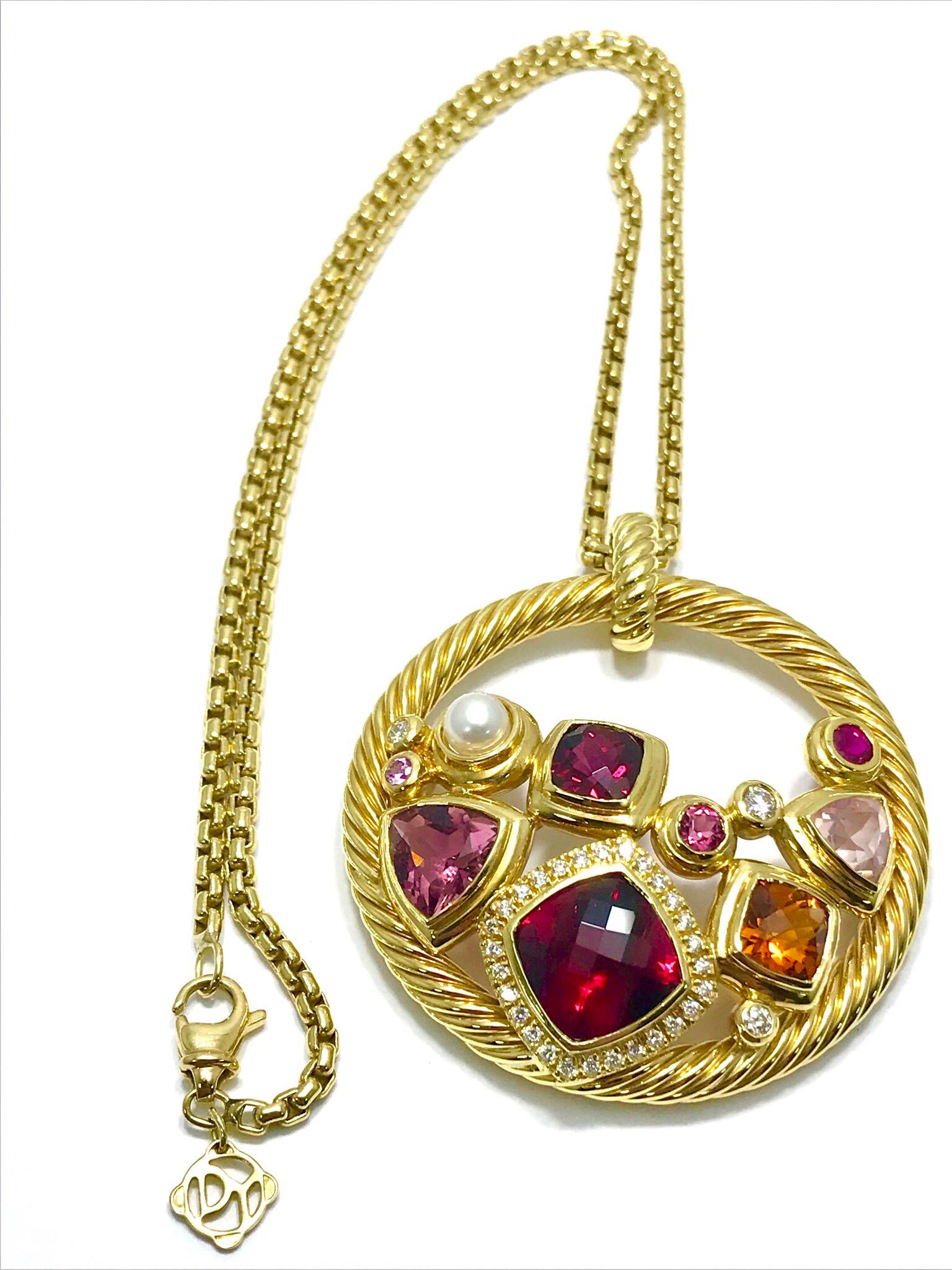 A gorgeous David Yurman Mosaic Diamond and multi gemstone 18 karat yellow gold pendant and chain.  The pendant contains 31 round brilliant Diamonds, with a total weight of 0.53 carats.  All of the gemstones are bezel set, consisting of Rubelite