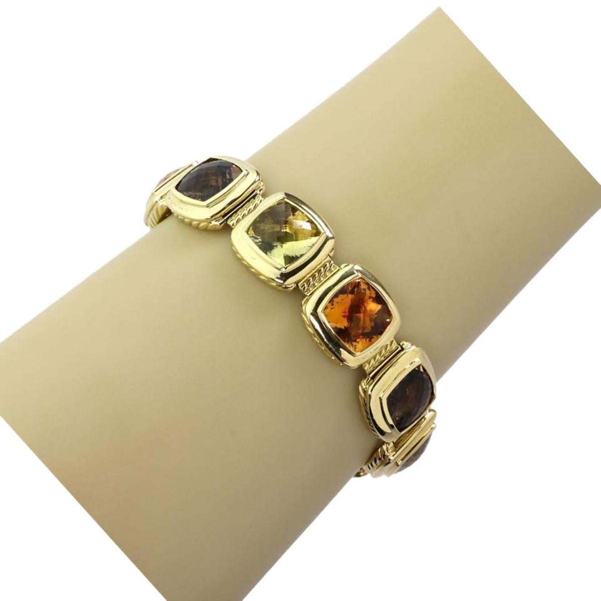 This stunning eye catching authentic bracelet is by David Yurman, it is crafted from 18k yellow gold with a high polished finish and has 10 cushion shaped frame, each joined together by a long slim cable hinged link. There are 9 faceted cut