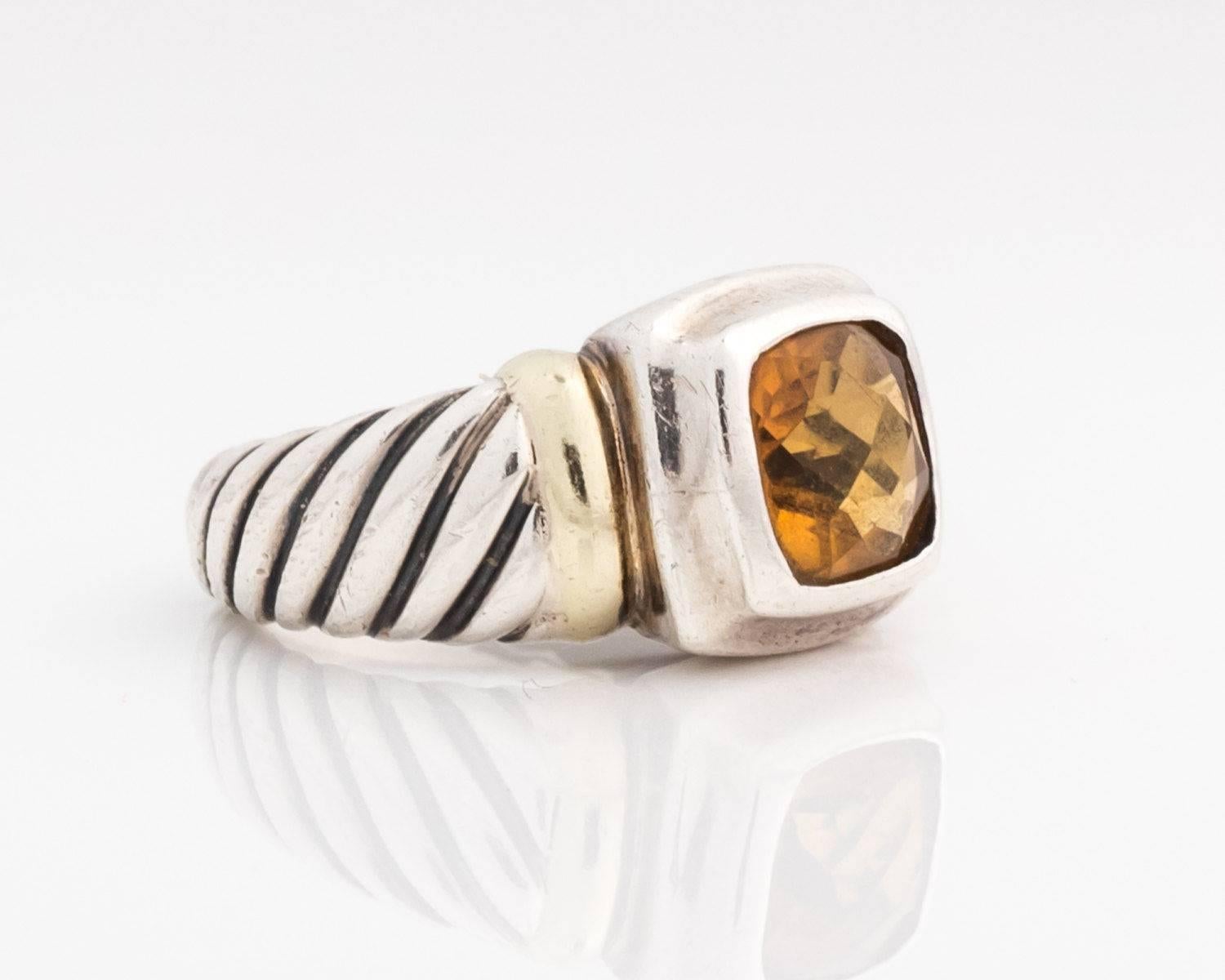 Petite Noblesse Ring with Citrine, Sterling Silver and 14 Karat Yellow Gold

Features a golden hued Citrine center stone bezel set in a Sterling Silver frame. The ring shoulders have a 14 Karat Yellow Gold accent band connecting to a Sterling Silver