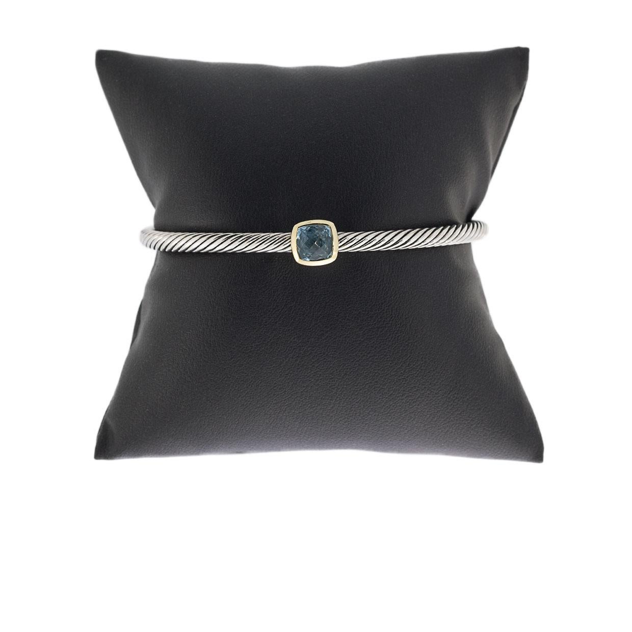 Item Details:
Estimated Retail - $495.00
Brand - David Yurman
Collection - Noblesse
Metal - 18 Karat Yellow Gold & 925 Sterling Silver
Style - Cuff Bracelet
Width - 4.00 mm
Colored Stone Color - Blue

Stone 1 Information:
Stone Type - Blue