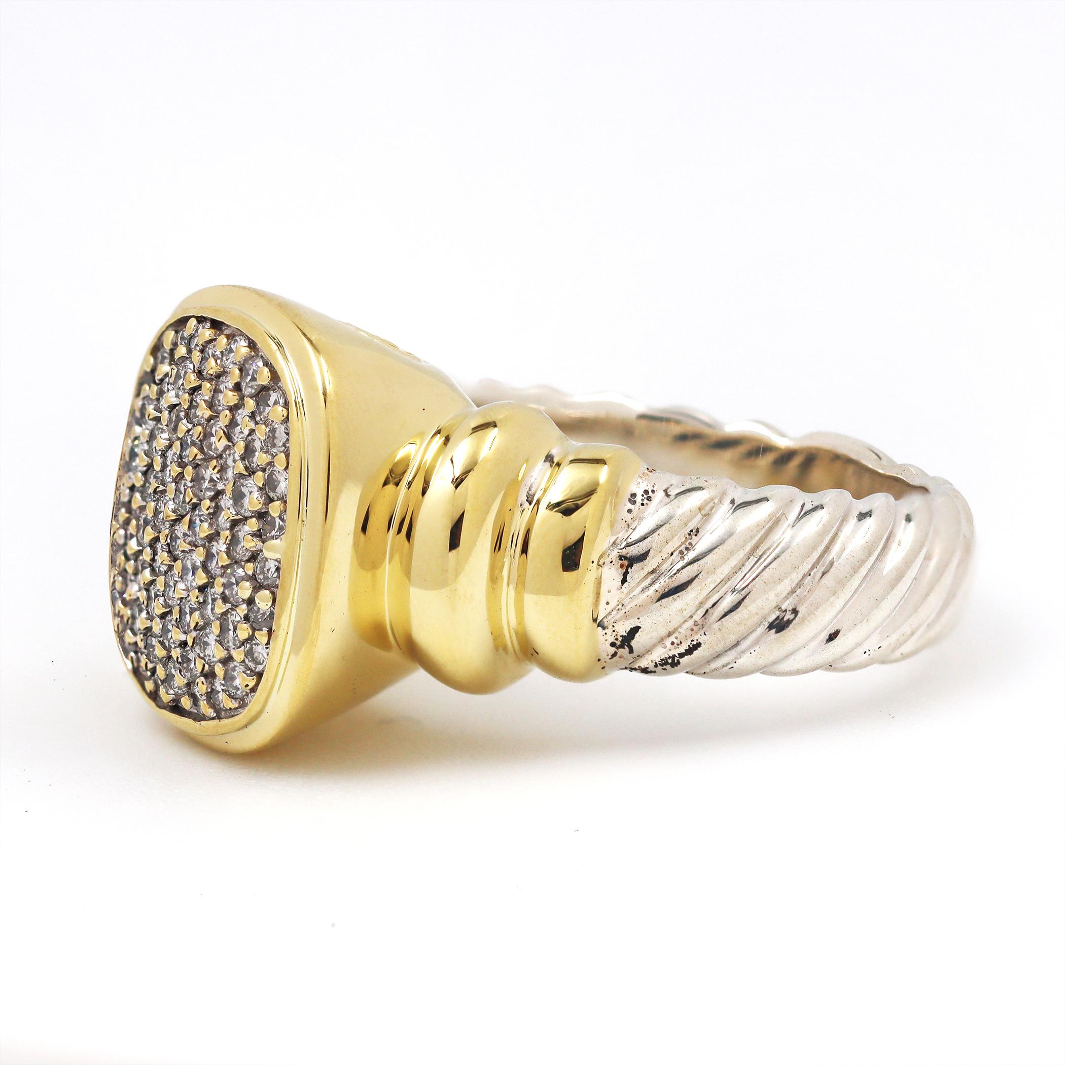 Authentic David Yurman ring from the 'Noblesse' collection. Crafted in sterling silver with an 18 karat yellow gold centerpiece set with approximately 0.68 carats of round brilliant cut diamonds. US size 8 3/4. Signed D.Y., 925, 18K. Ring is