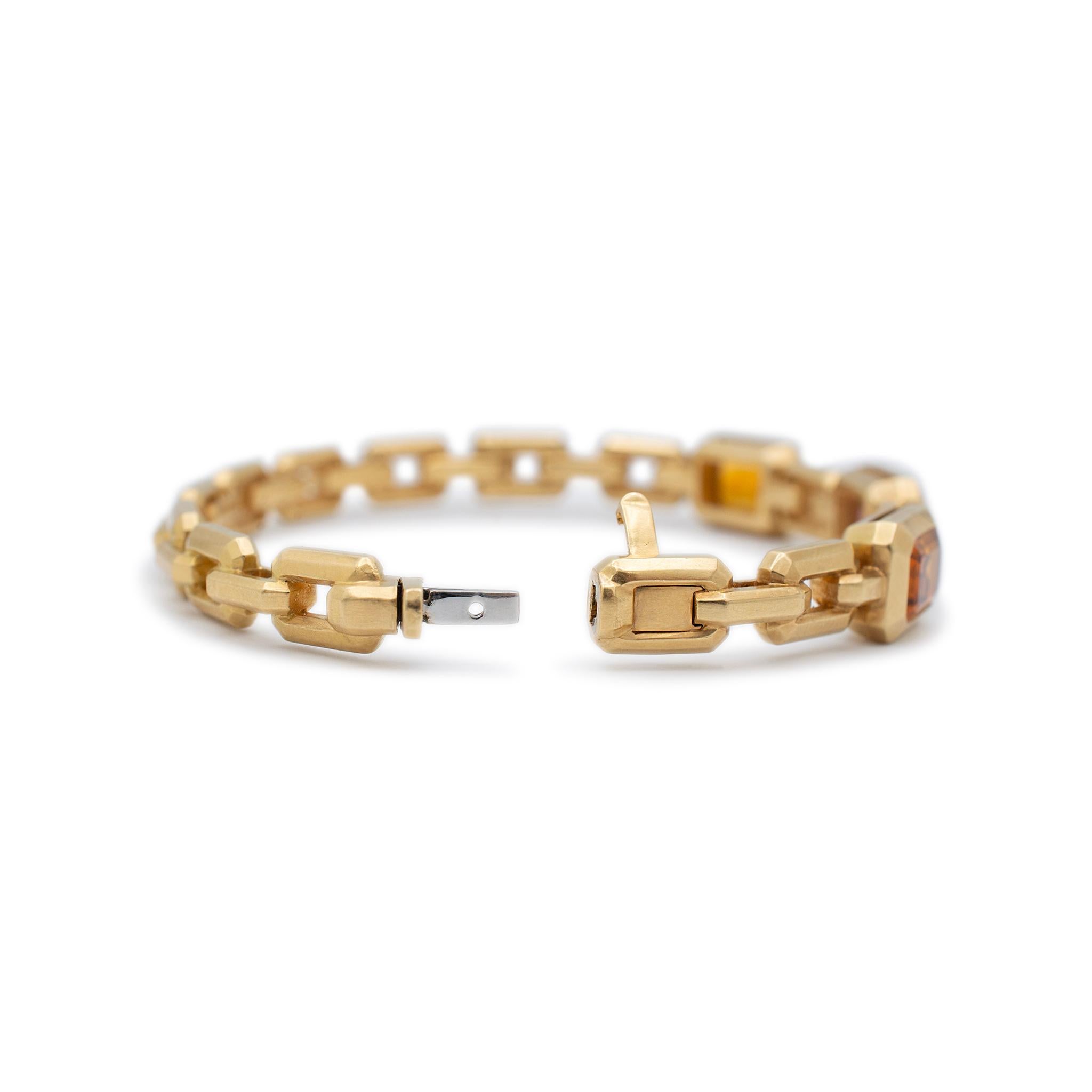 Brand: David Yurman

Gender: Ladies

Metal Type: 18K Yellow Gold

Length: 6.00 inches

Width : 8.45 mm

Weight: 32.88 grams

18K yellow gold citrine and pink tourmaline bangle bracelet. The metal was tested and determined to be 18K yellow gold.
