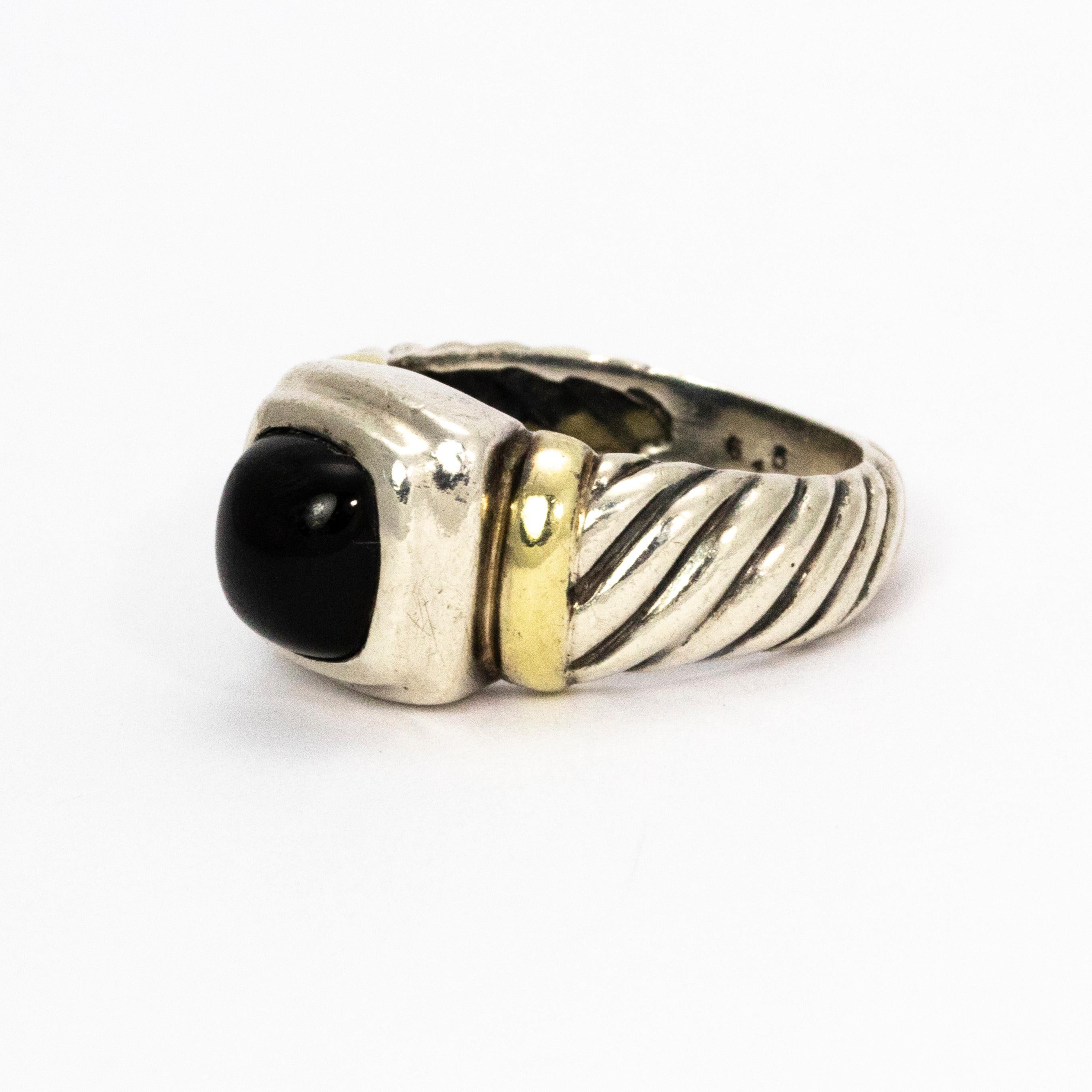 A beautifully detailed silver cable ring with 14k gold details finished with a perfectly glossy Onyx.

Ring Size: M 1/2 or 7