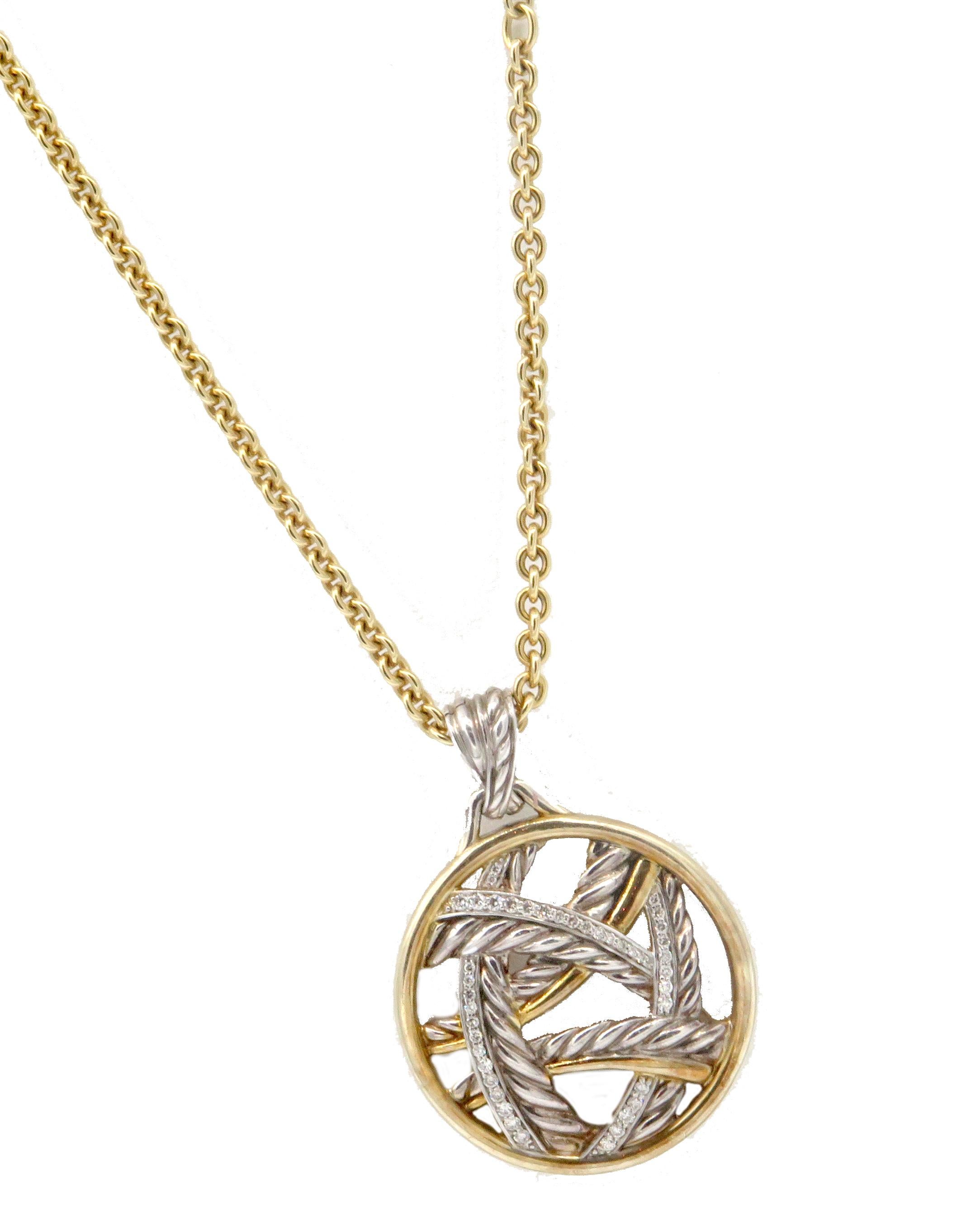 A beautiful round pendant by David Yurman, Signed on the back. This gorgeous pendent comes from the Papyrus Collection. This particular pendant comes with diamonds and is 925 Sterling Silver with gold accents. The pendant weighs 27.87 grams and is