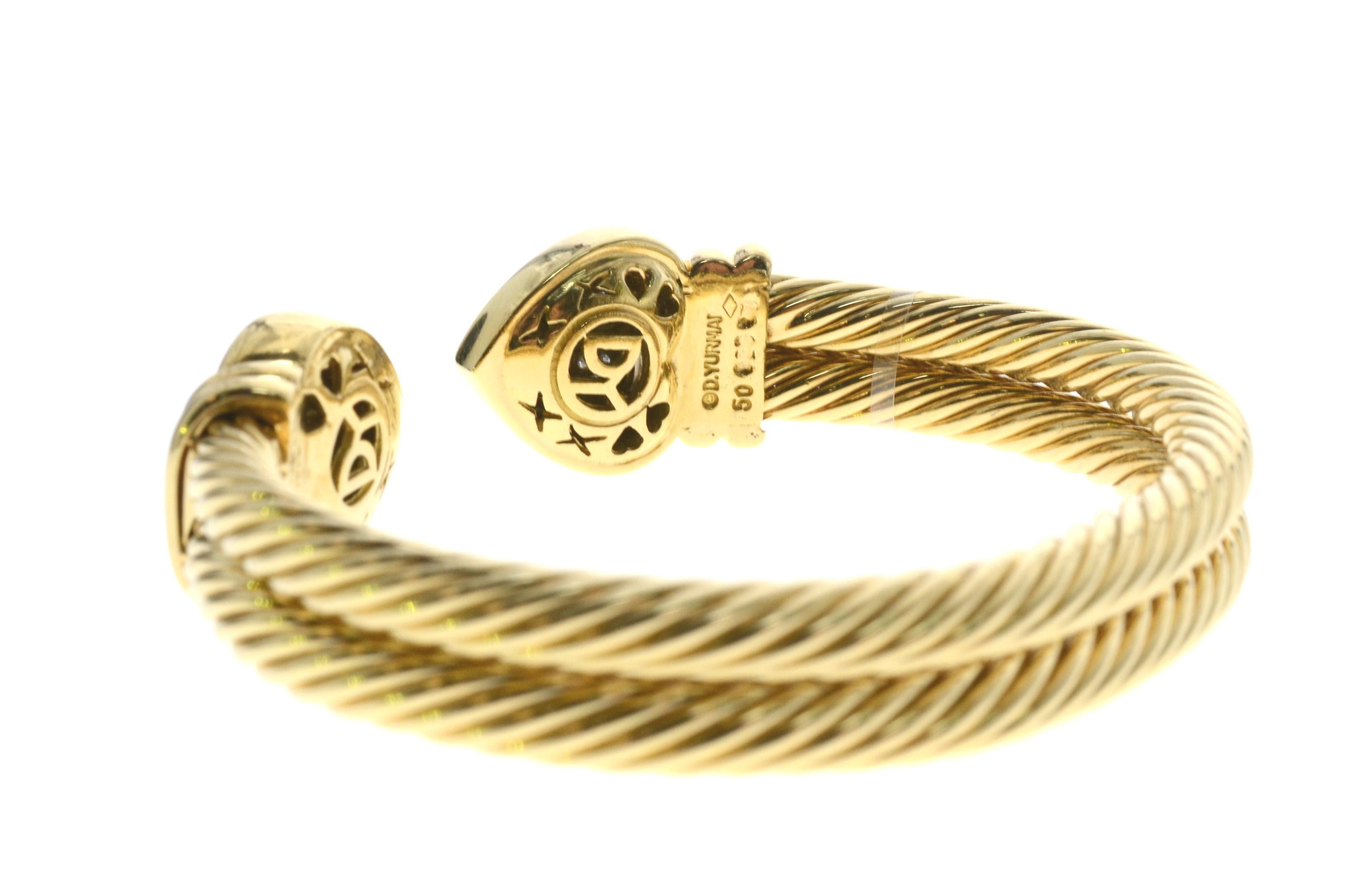 Brand: David Yurman

Style: Double Cable

Model:  Hearts Cuff Bracelet.

Metal: 18k Yellow Gold

Stones: Diamond

Stones Setting: Pave

Stone Weight: Approx .65ct

Stone Grading: Approx G-VS2

Hallmarked: David Yurman 18k