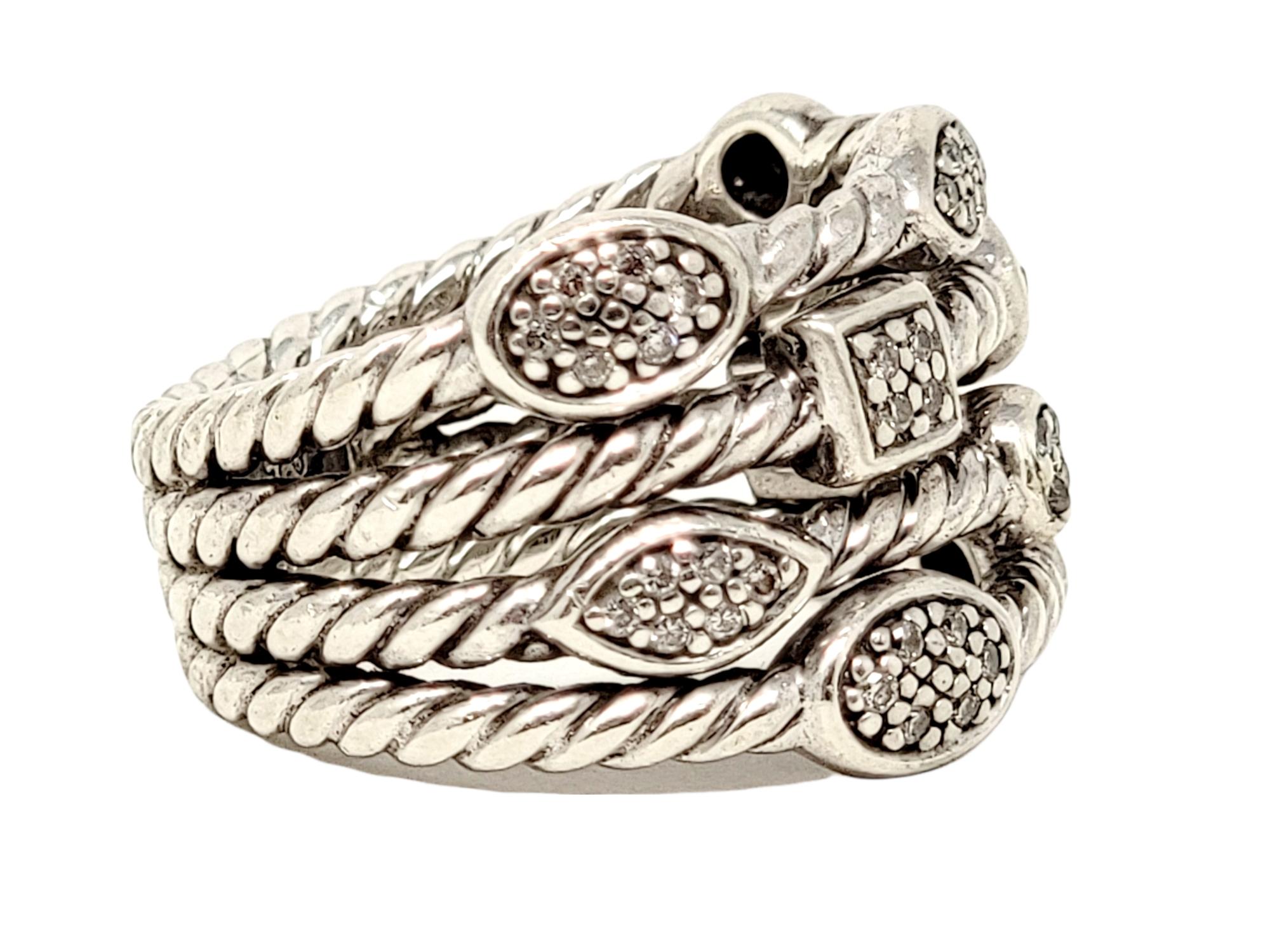 Ring size: 5.75

Gorgeous contemporary cable ring by jewelry designer, David Yurman. It features his signature twisted cable design in sterling silver accented by assorted shaped pave diamond stations throughout. 

Metal: Sterling Silver
Size: