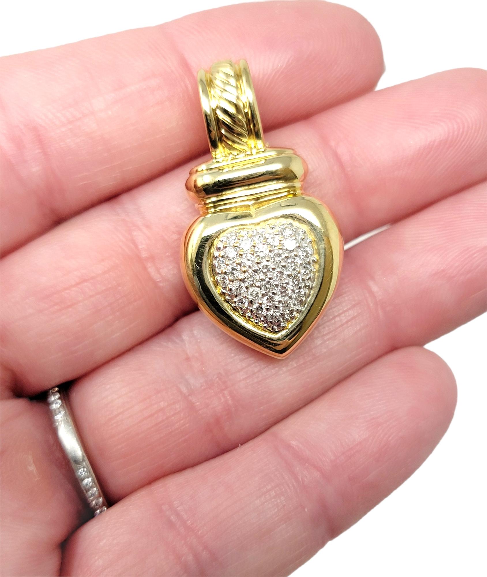 Lovely designer pendant by David Yurman features a polished 18 karat yellow gold heart embellished with glittering pave diamonds. This listing is for the pendant only, no necklace is included. 

Item type: Pendant
Metal: 18K Yellow Gold
Weight: 12.6