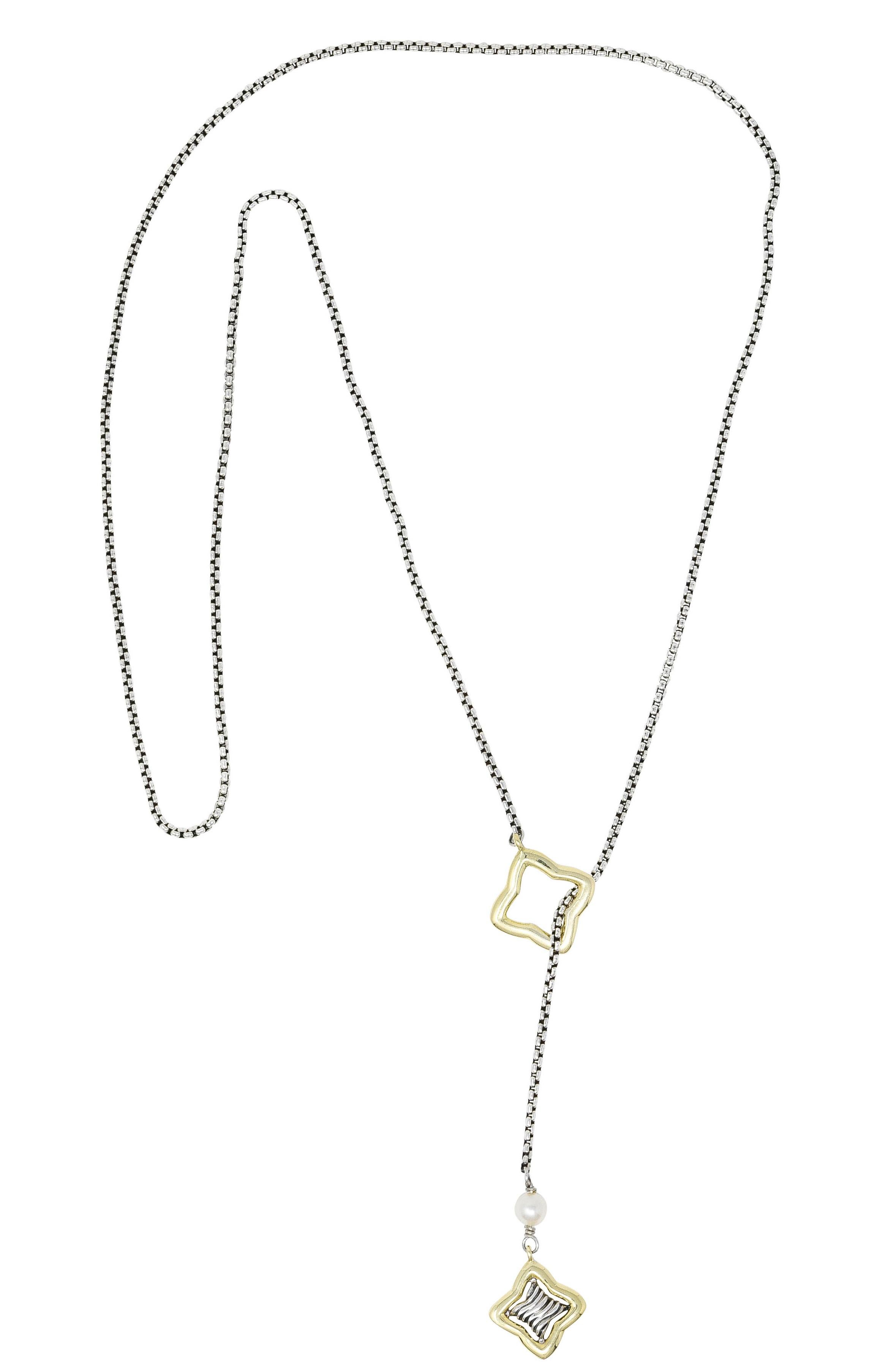 Lariat style necklace designed as 2.0 mm box chain terminating with stylized ends

One end has a gold quatrefoil centering a silver classic cable motif suspended from a 3.0 mm pearl bead

Pearl is white in body color with moderate rosè overtones and