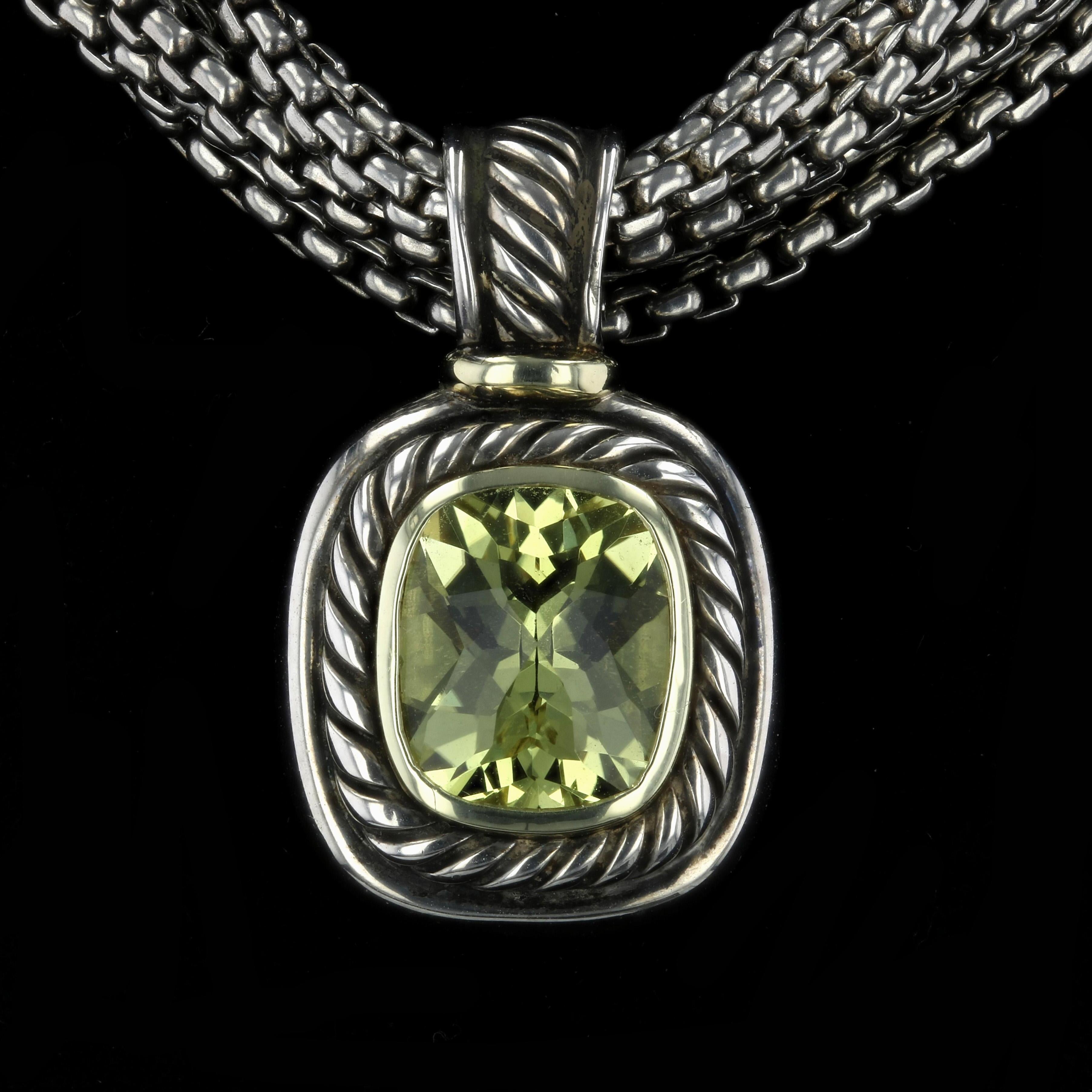 Estate David Yurman pendant with classic cable twist motif. In the center is one rectangular cushion cut yellow-green peridot measuring approximately 11mm x 13mm.