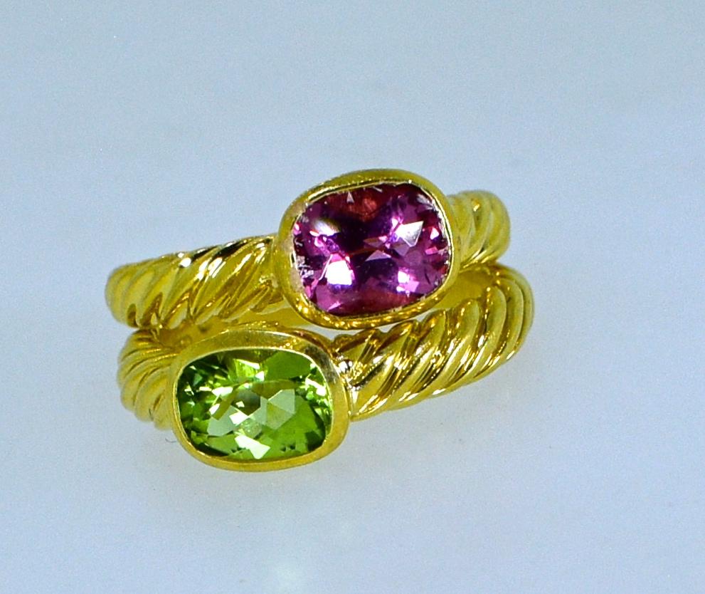 David Yurman Peridot and Pink Tourmaline rings - matching, they are rose cut, and bezel set in 18K gold.  The rings are a size 7, and marked in the shank along with the gold content, 750 and the David Yurman hallmark,  They are in new condition.  We