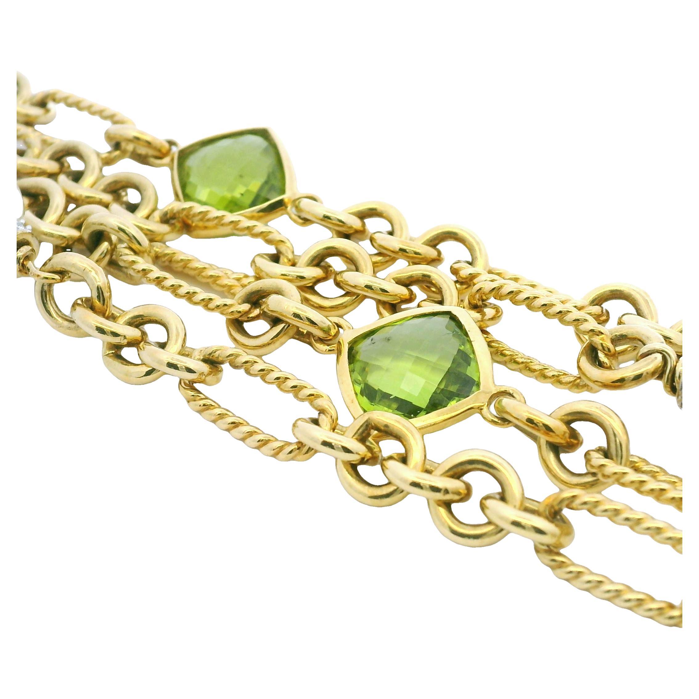 David Yurman 18k Yellow Gold Peridot, Pearl & Diamond 4-Strand Oval-Link Bracelet

Designer: David Yurman
Material: 18k Yellow Gold
Gemstone Details: There are 3, faceted, bezel-set, green peridots, as well as 3, large pearls with diamond